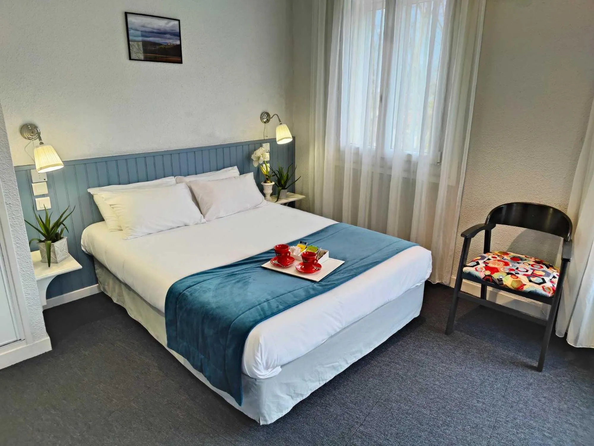 Bedroom in Logis Hôtel Cartier