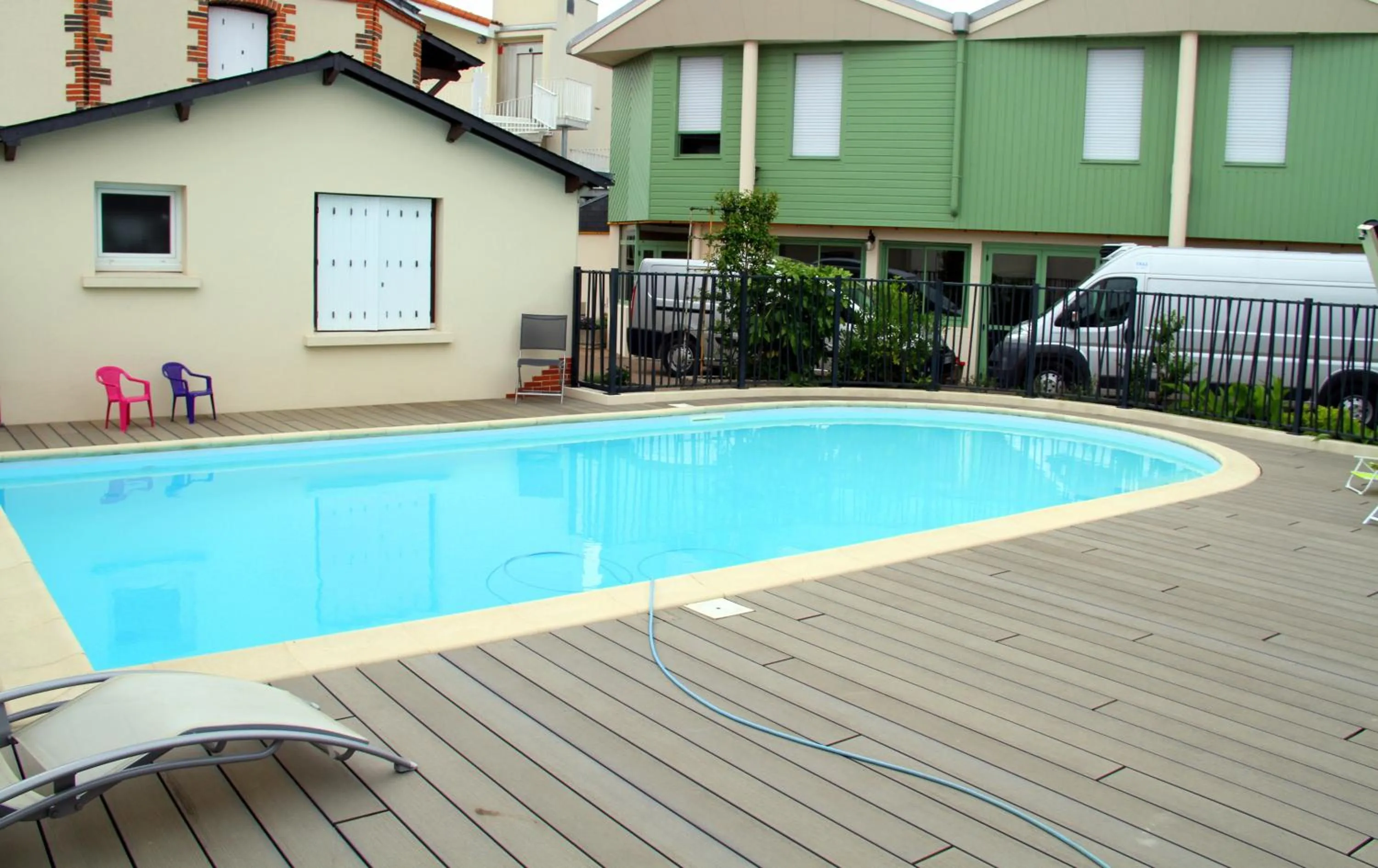 Swimming pool in Logis Hotel Restaurant Le Grand Turc