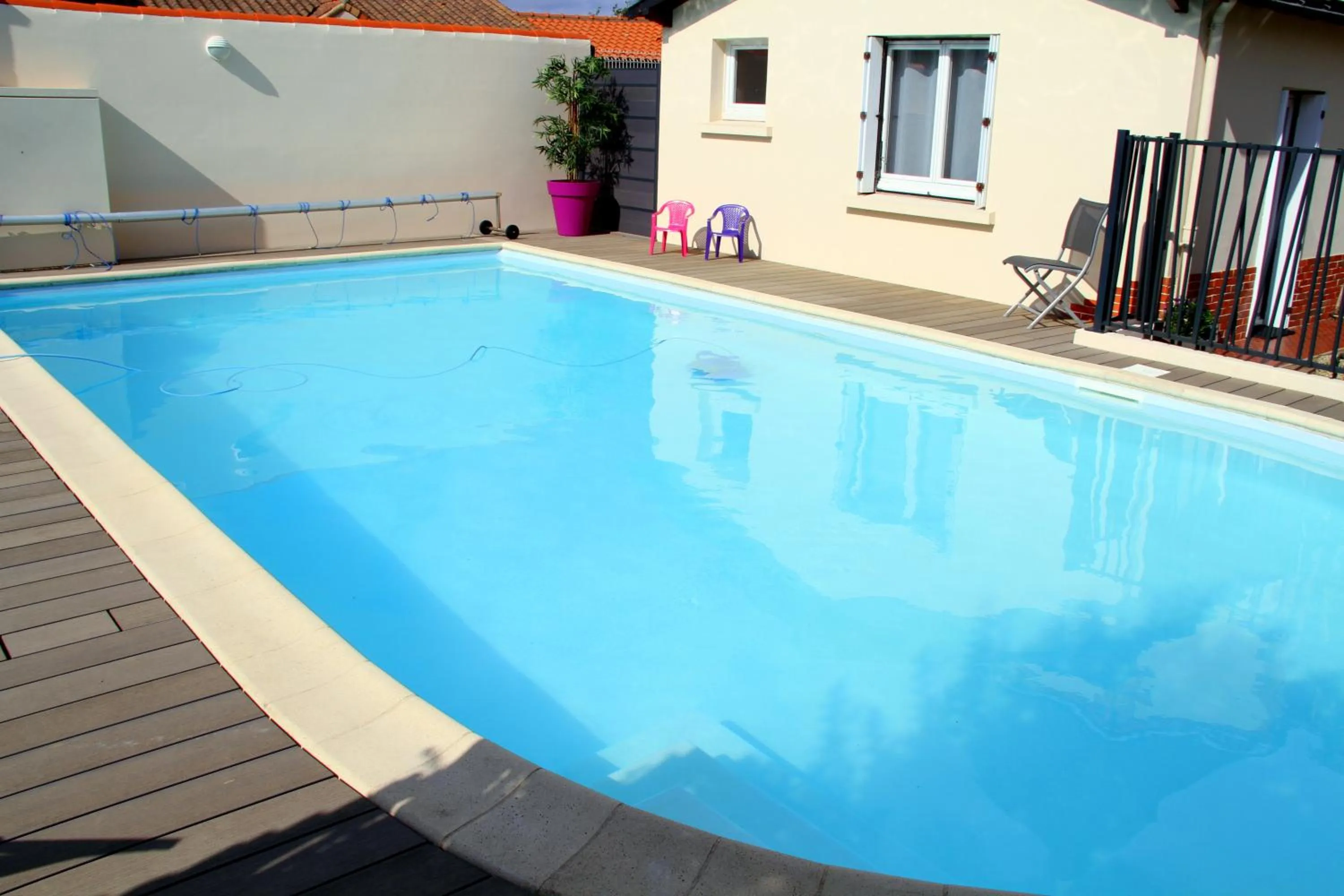 Swimming pool in Logis Hotel Restaurant Le Grand Turc