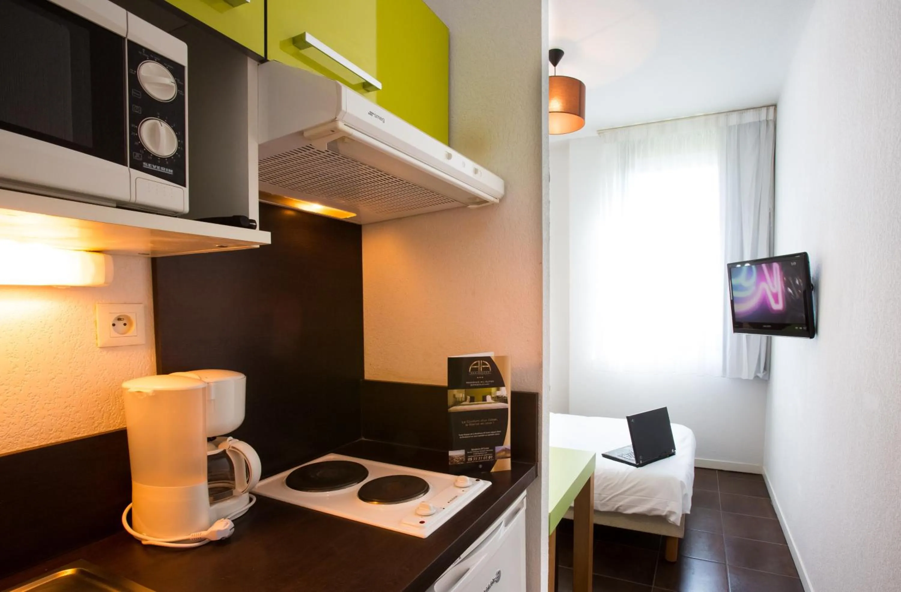 Kitchen or kitchenette in All Suites Appart Hôtel - Bordeaux Lac