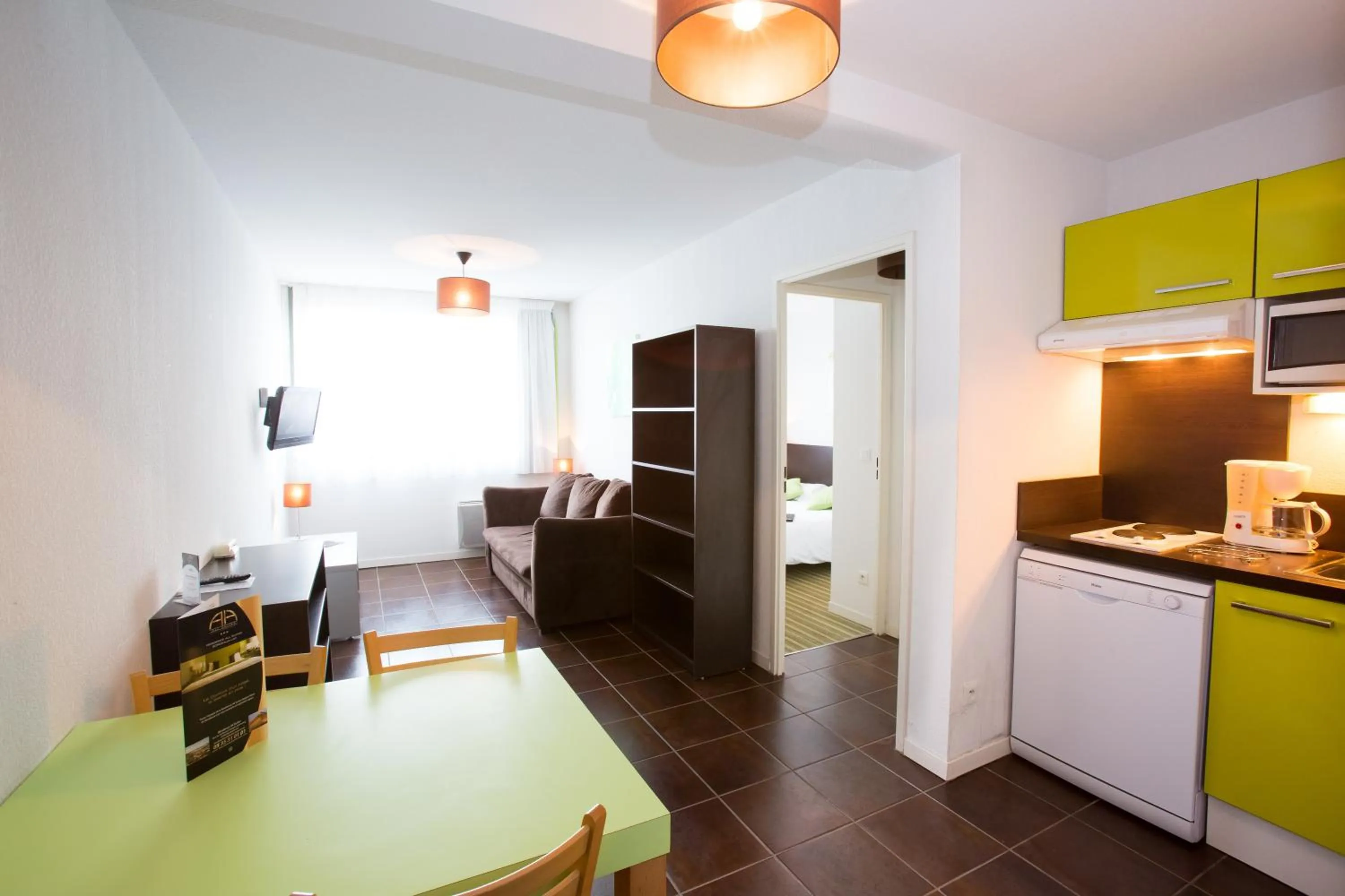 Kitchen or kitchenette in All Suites Appart Hôtel - Bordeaux Lac