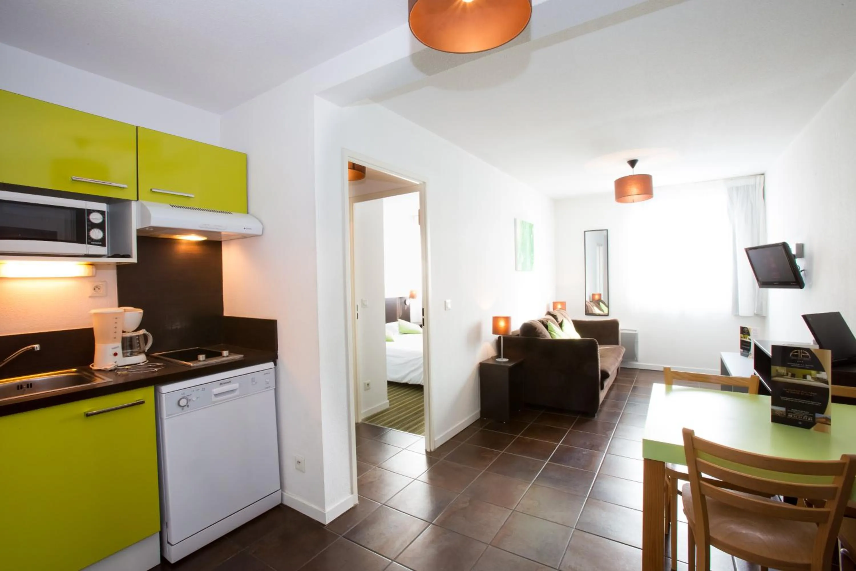 Kitchen or kitchenette in All Suites Appart Hôtel - Bordeaux Lac