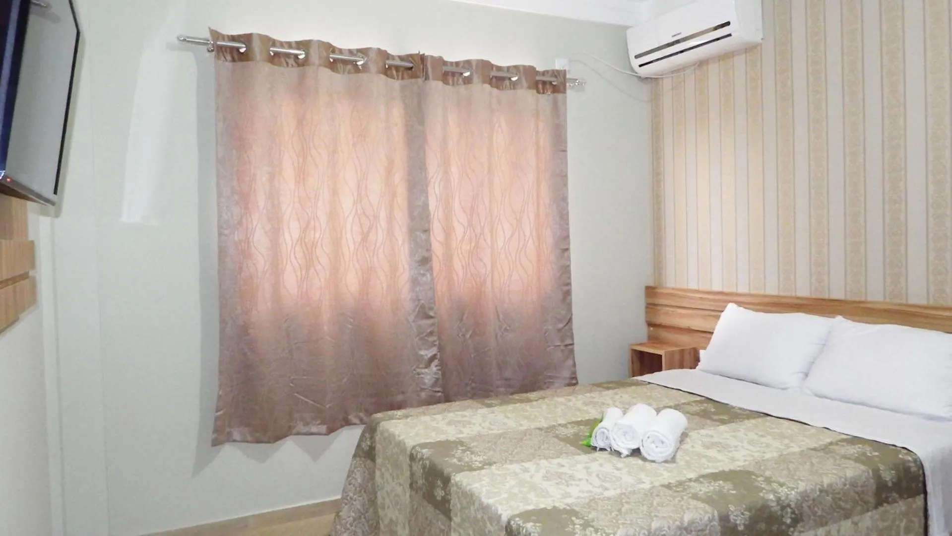 Bed in Coral Palace Hotel