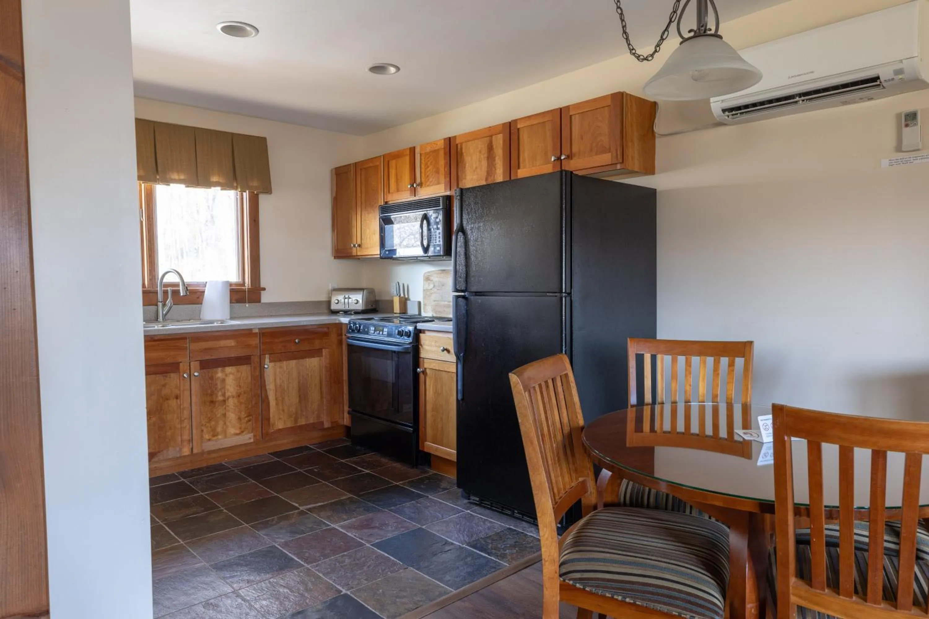 Kitchen or kitchenette in Winwood Condominiums by Windham Mountain Club