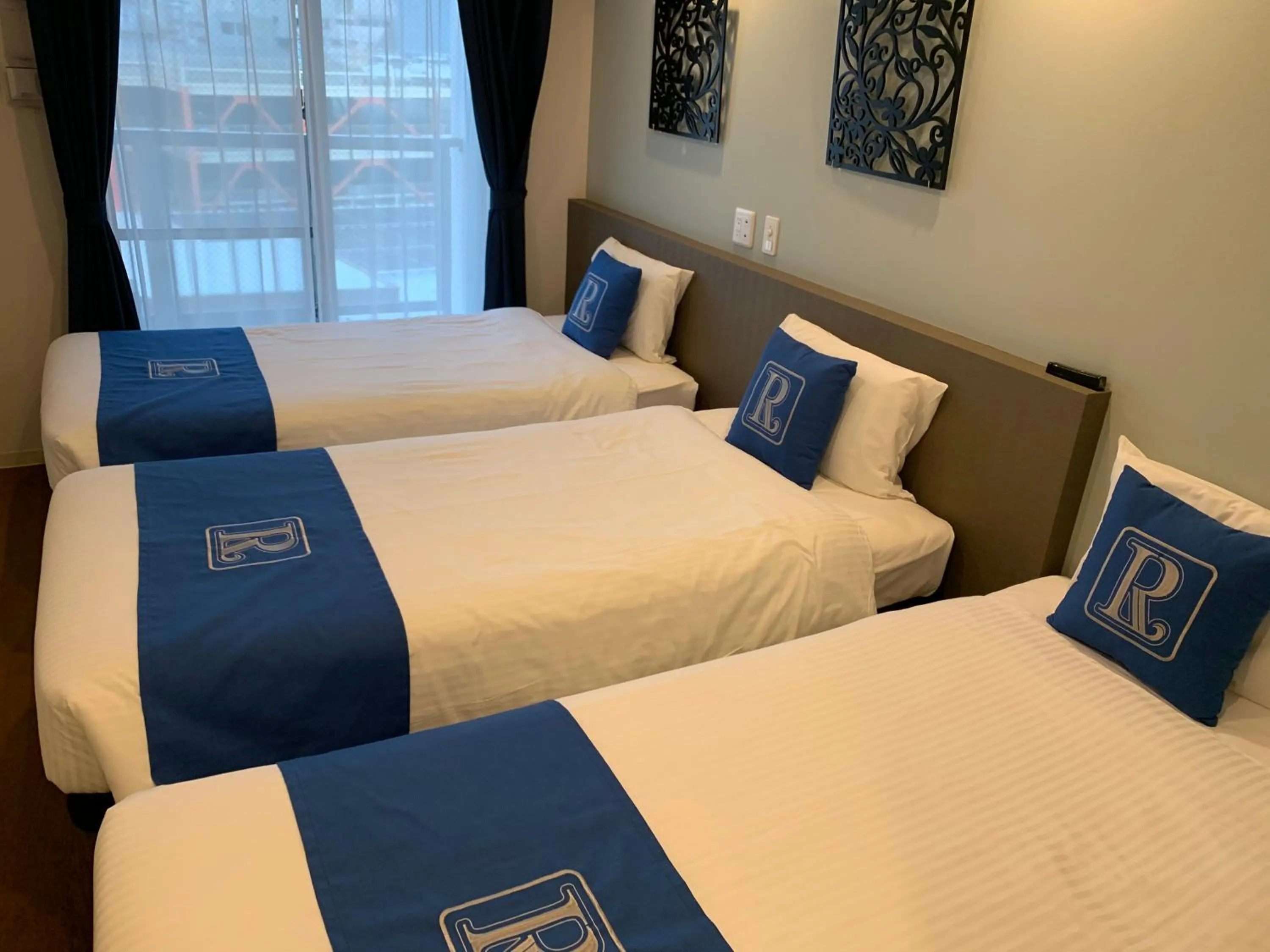 Bed in Living Inn Asahibashiekimae Premier