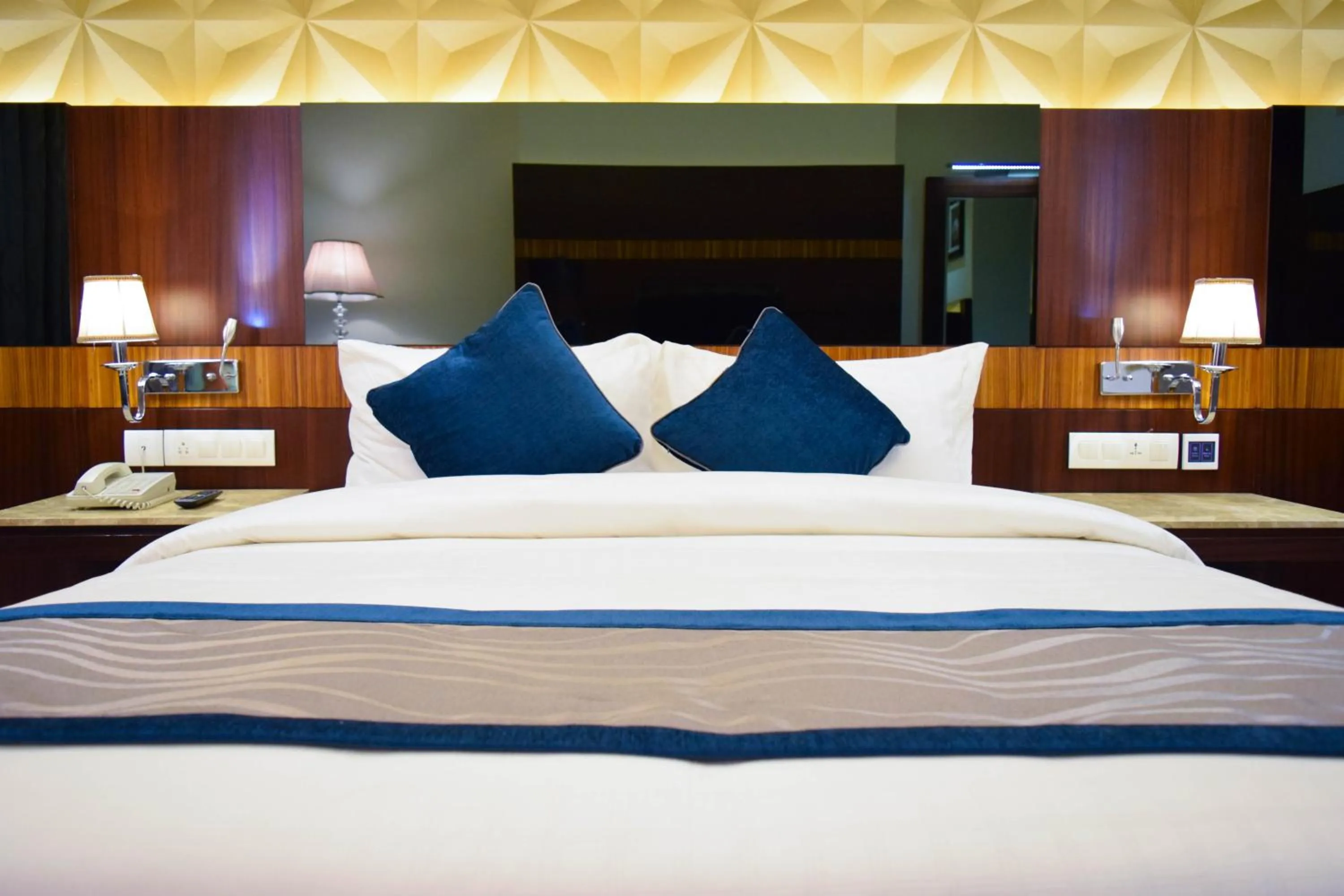 Bed in Rg Royal Hotel