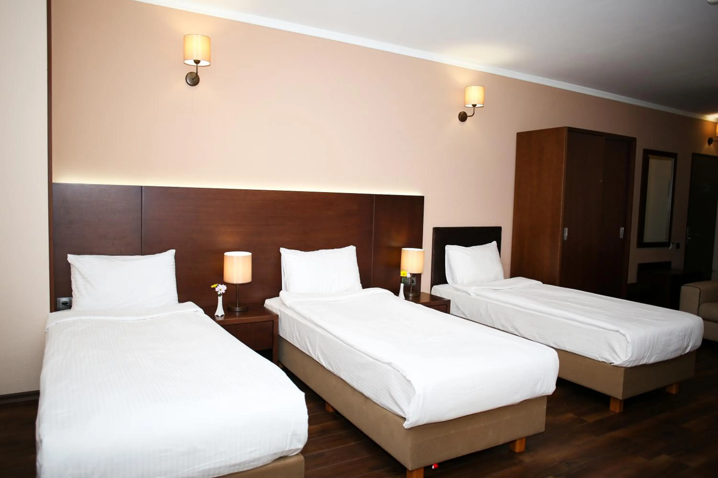 Bed in Hotel Corner Inn