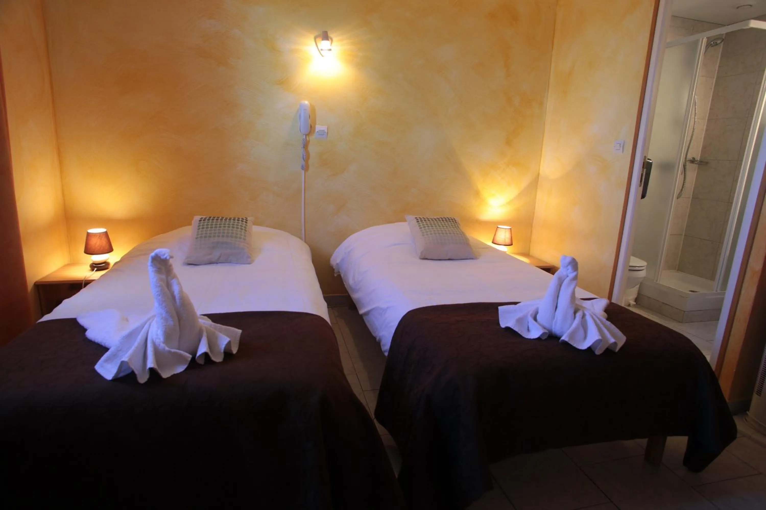 Bed in Logis Hôtel LE PRESSOIR