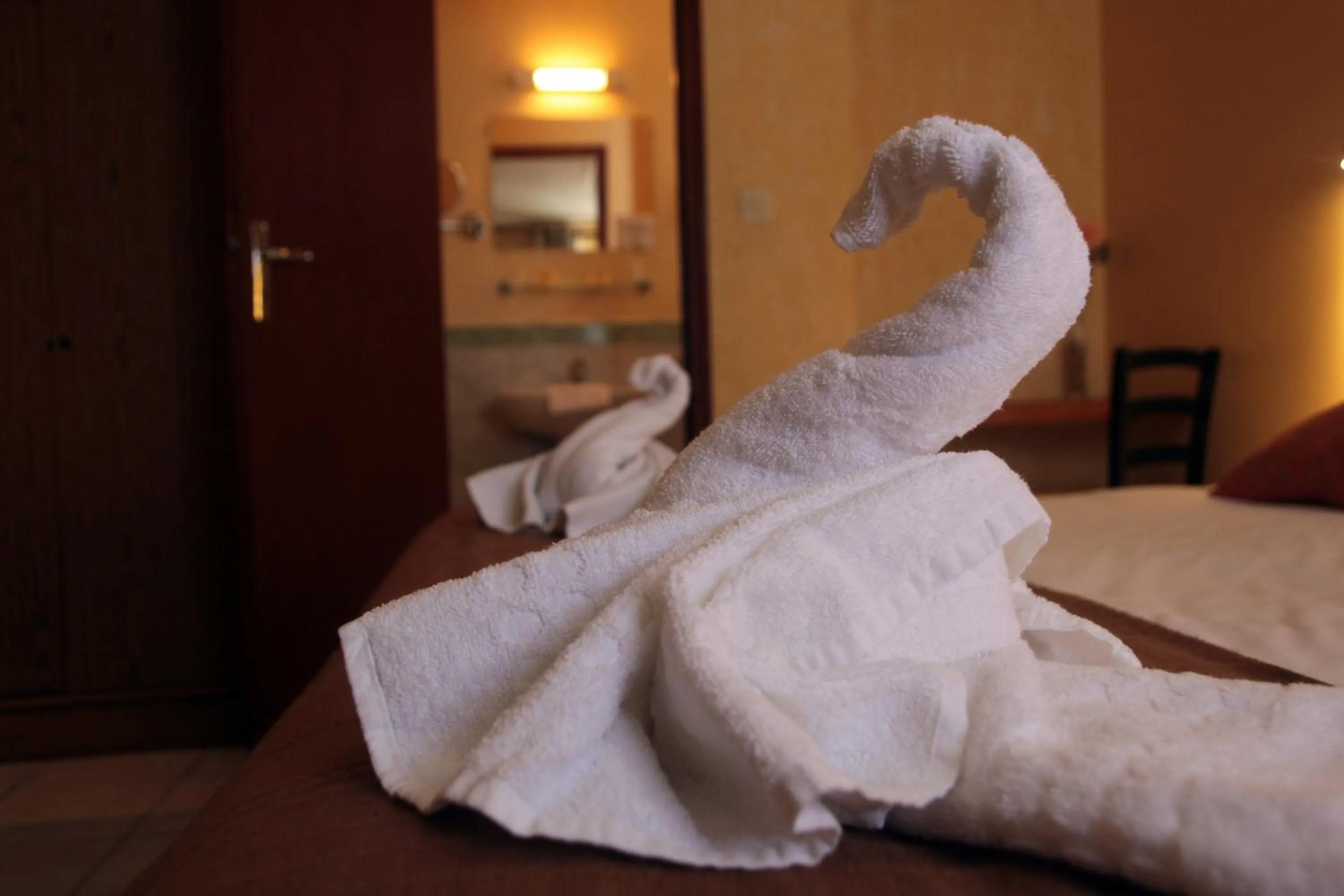 Bed in Logis Hôtel LE PRESSOIR