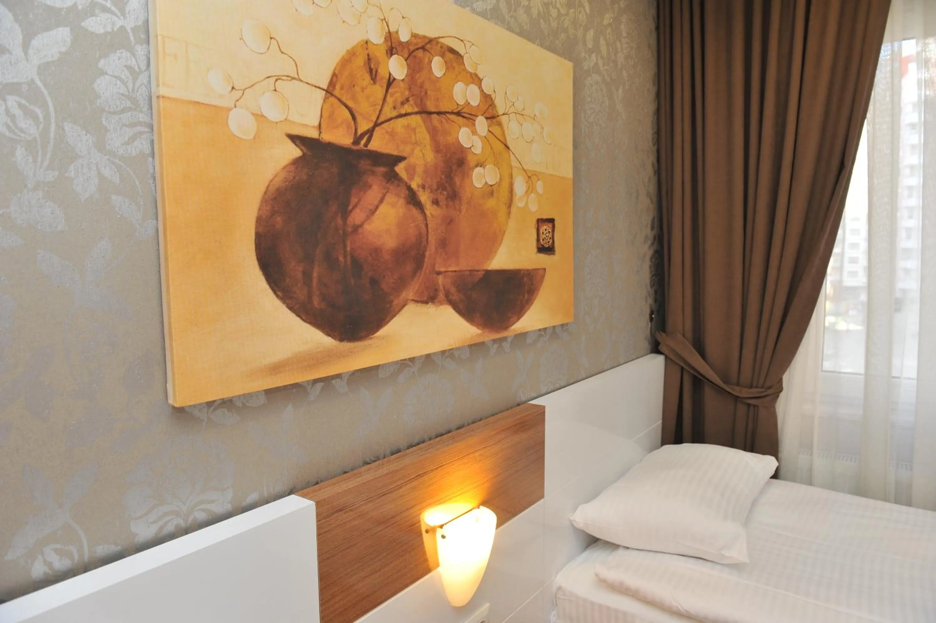 Decorative detail, Bed in Qamar Prestige Suites