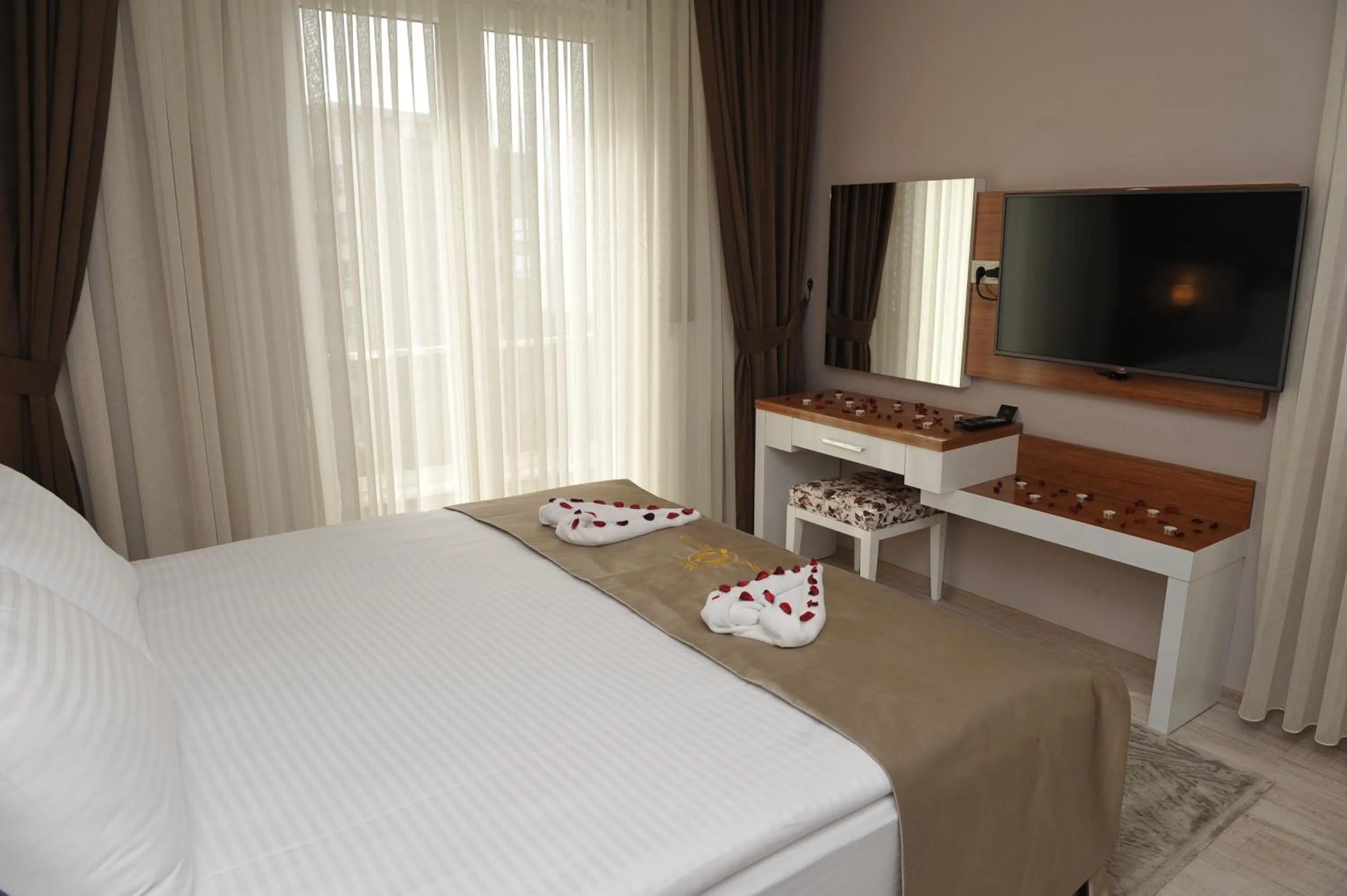 Bed in Qamar Prestige Suites