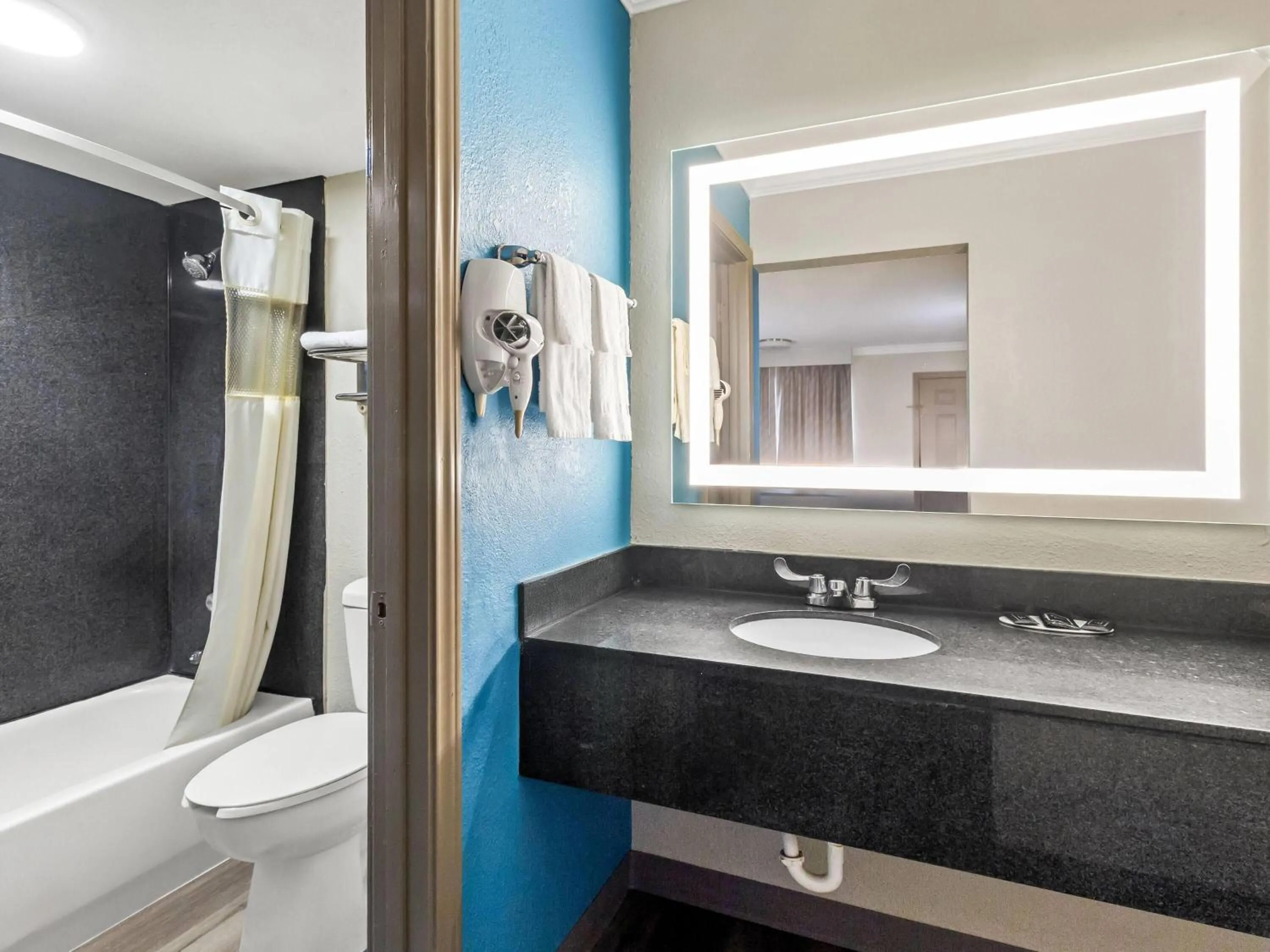 Bathroom in Days Inn by Wyndham Houston East