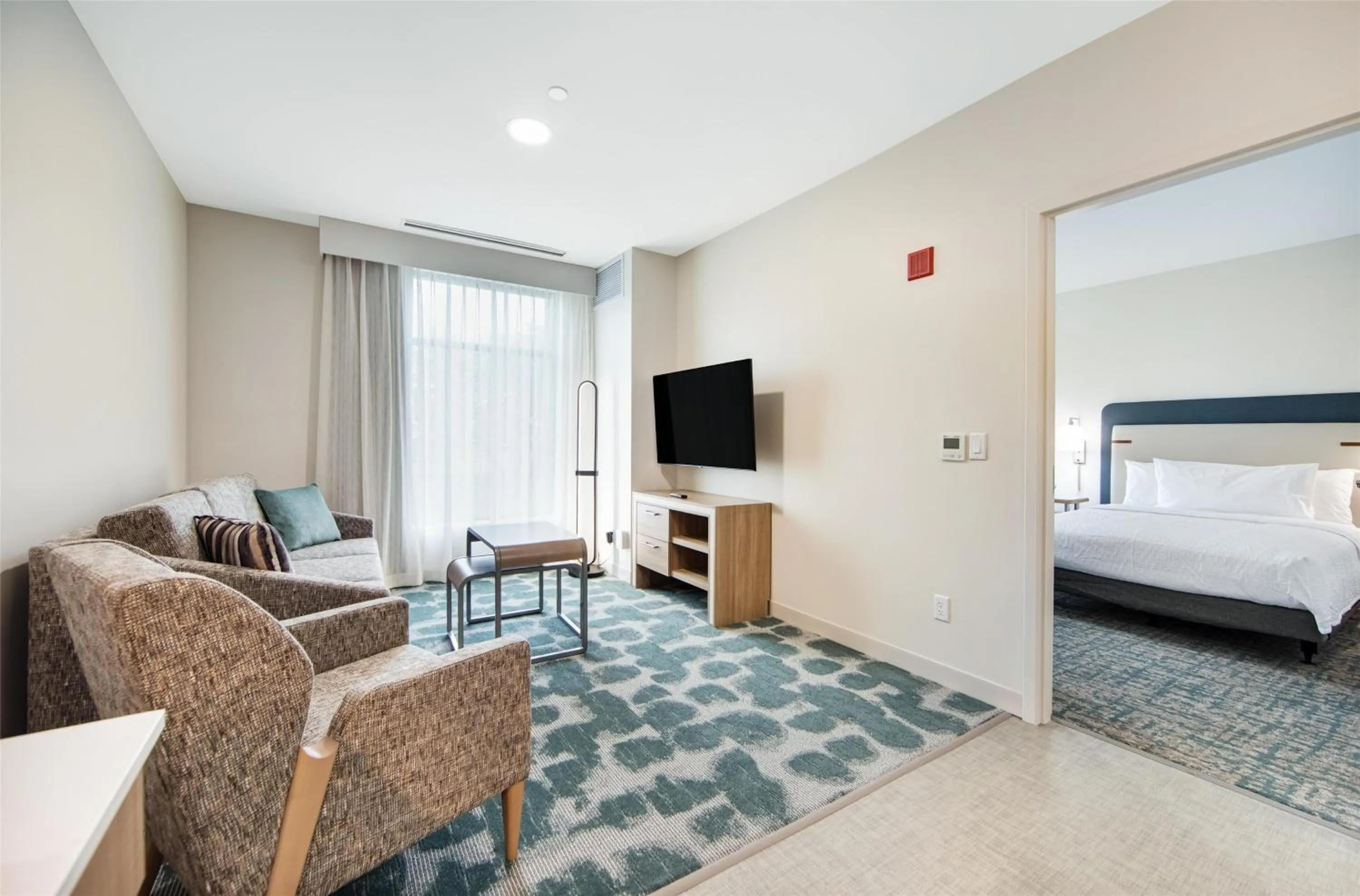 Living room, Bed in Homewood Suites by Hilton East Rutherford - Meadowlands, NJ