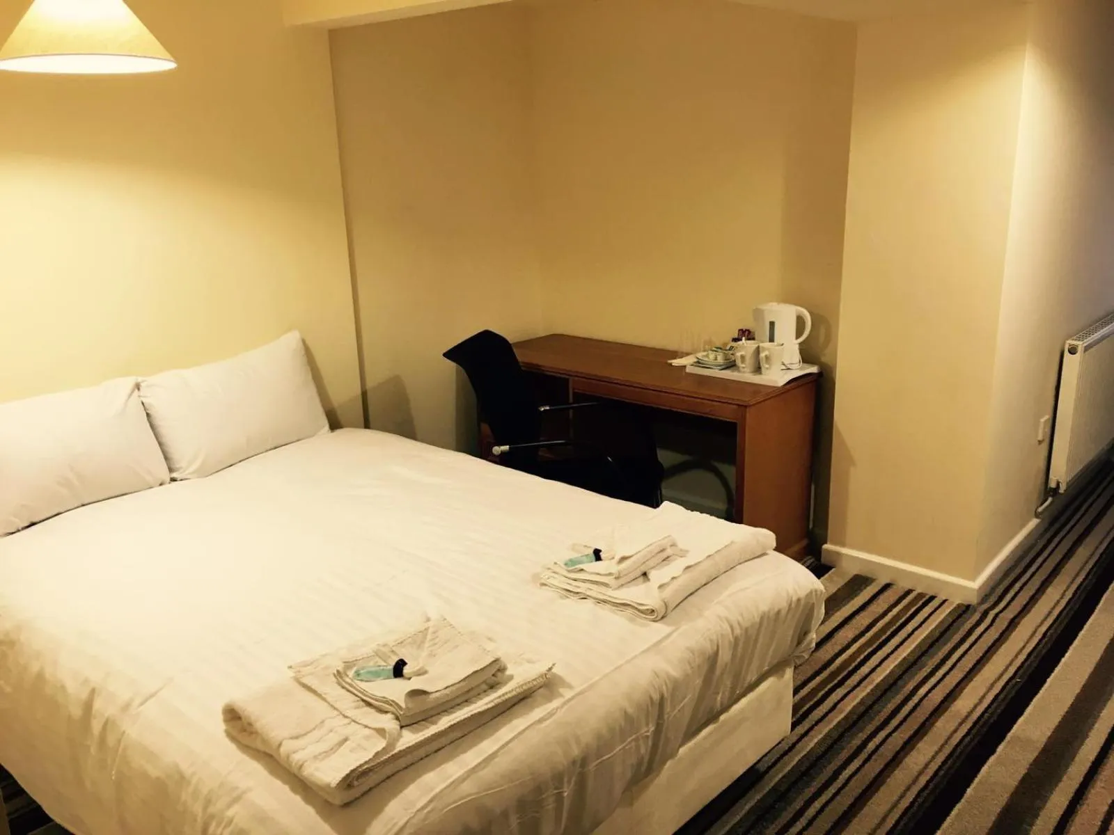 Bed in The Tudor House Hotel