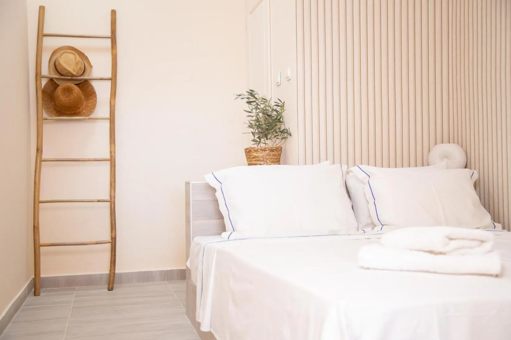 Bed in Poseidon Apartments and Villas by the Sea