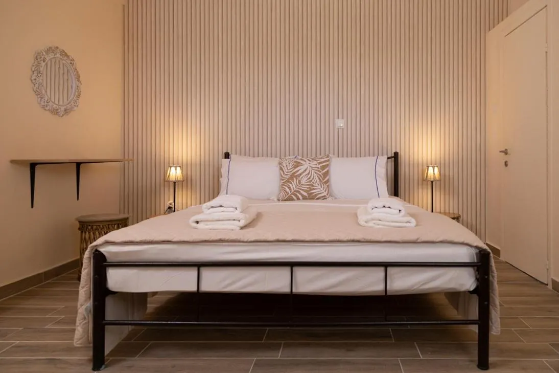 Bed in Poseidon Apartments and Villas by the Sea