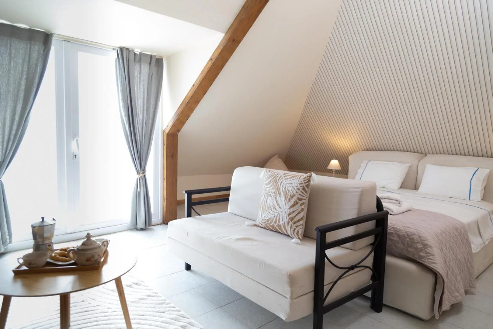 Bed in Poseidon Apartments and Villas by the Sea