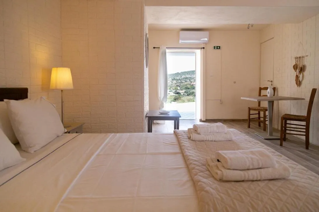 Bed in Poseidon Apartments and Villas by the Sea