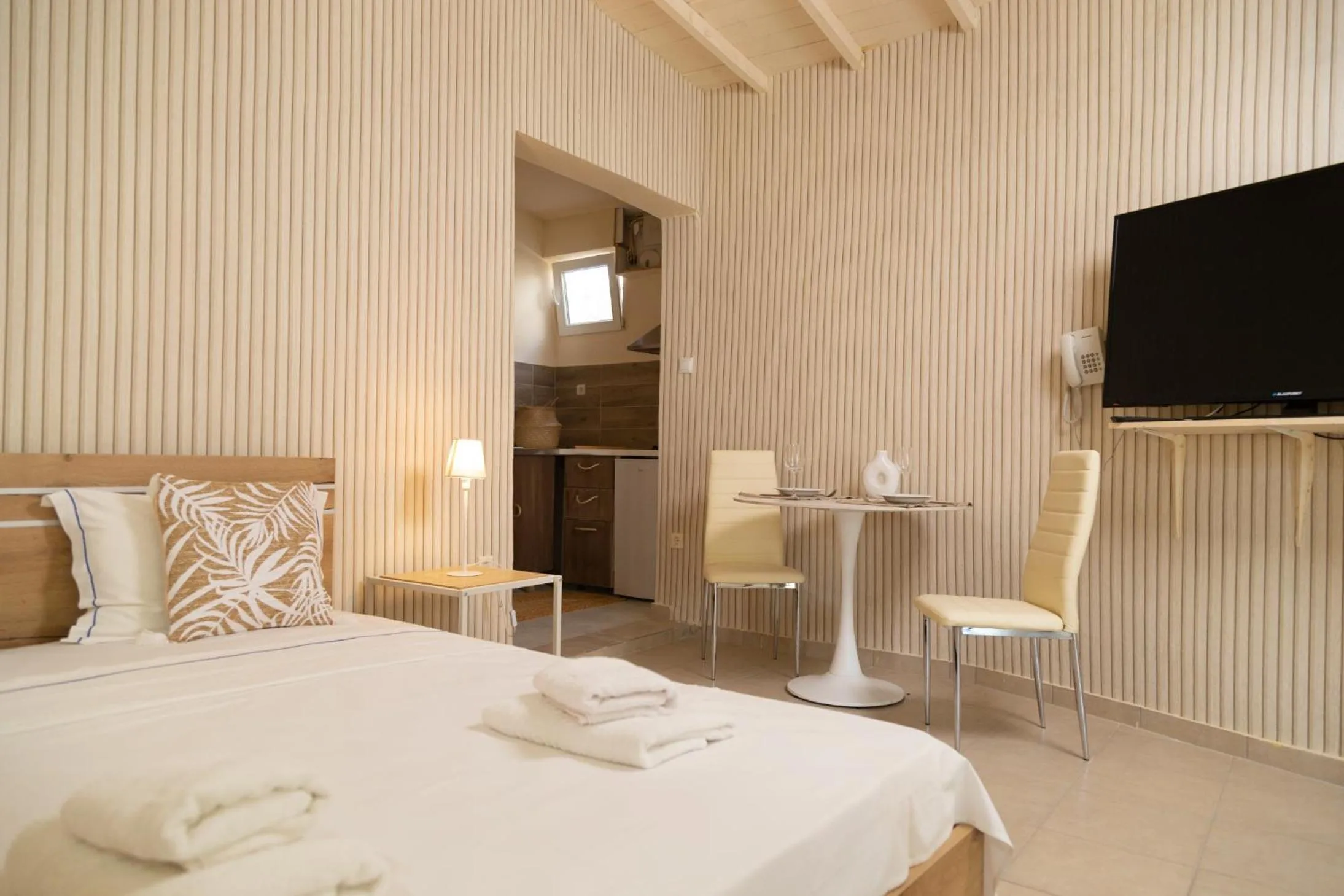 Bed in Poseidon Apartments and Villas by the Sea