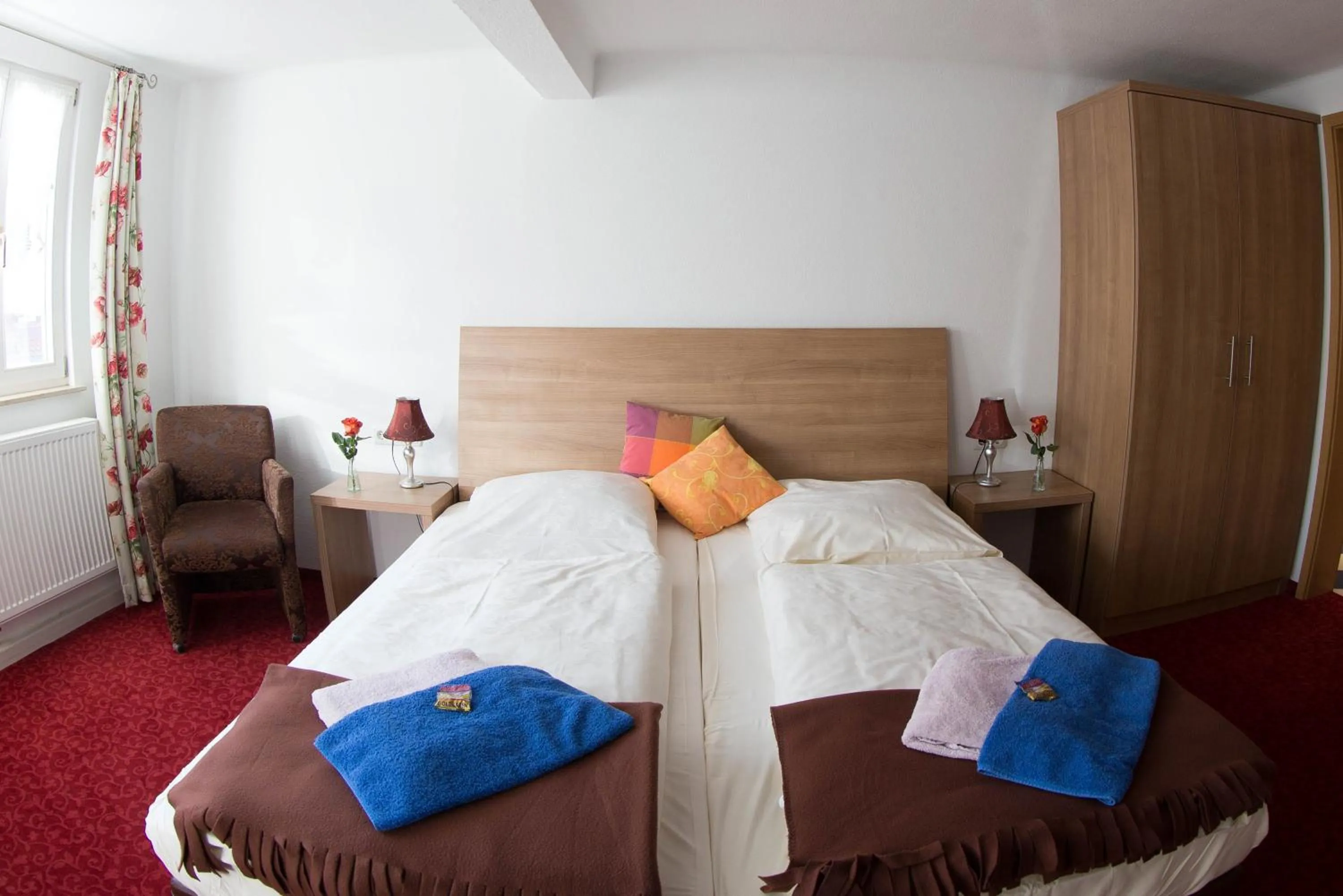 Bed in Boutiquehotel Goldene Rose - self-check-in