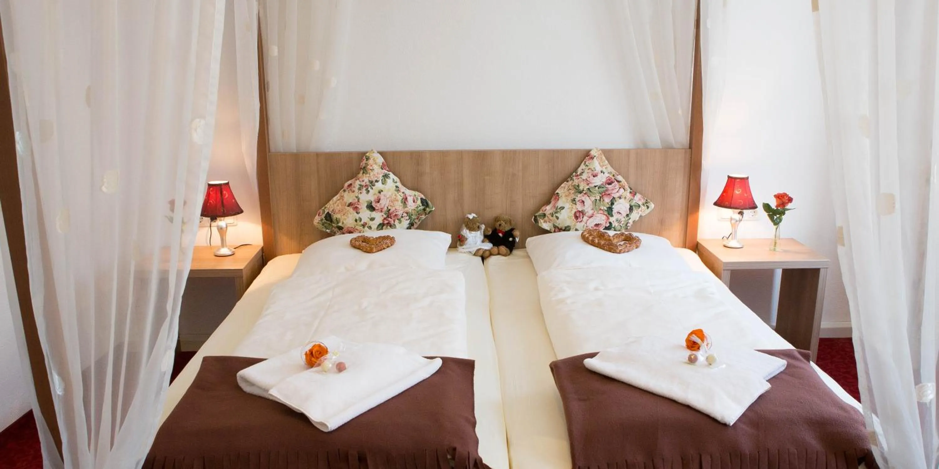 Bed in Boutiquehotel Goldene Rose - self-check-in