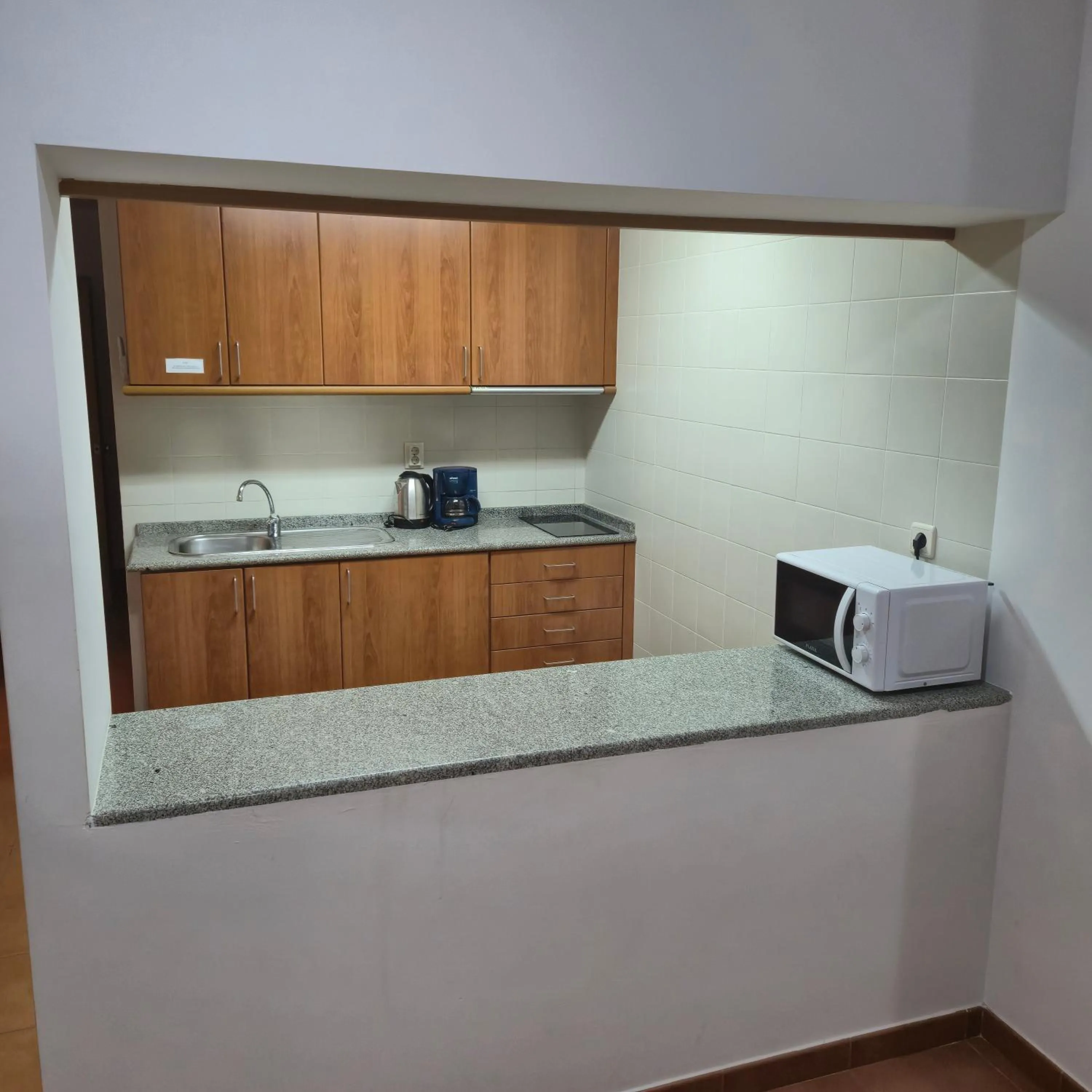 Kitchen or kitchenette in Apartamentos Turísticos Vila Praia