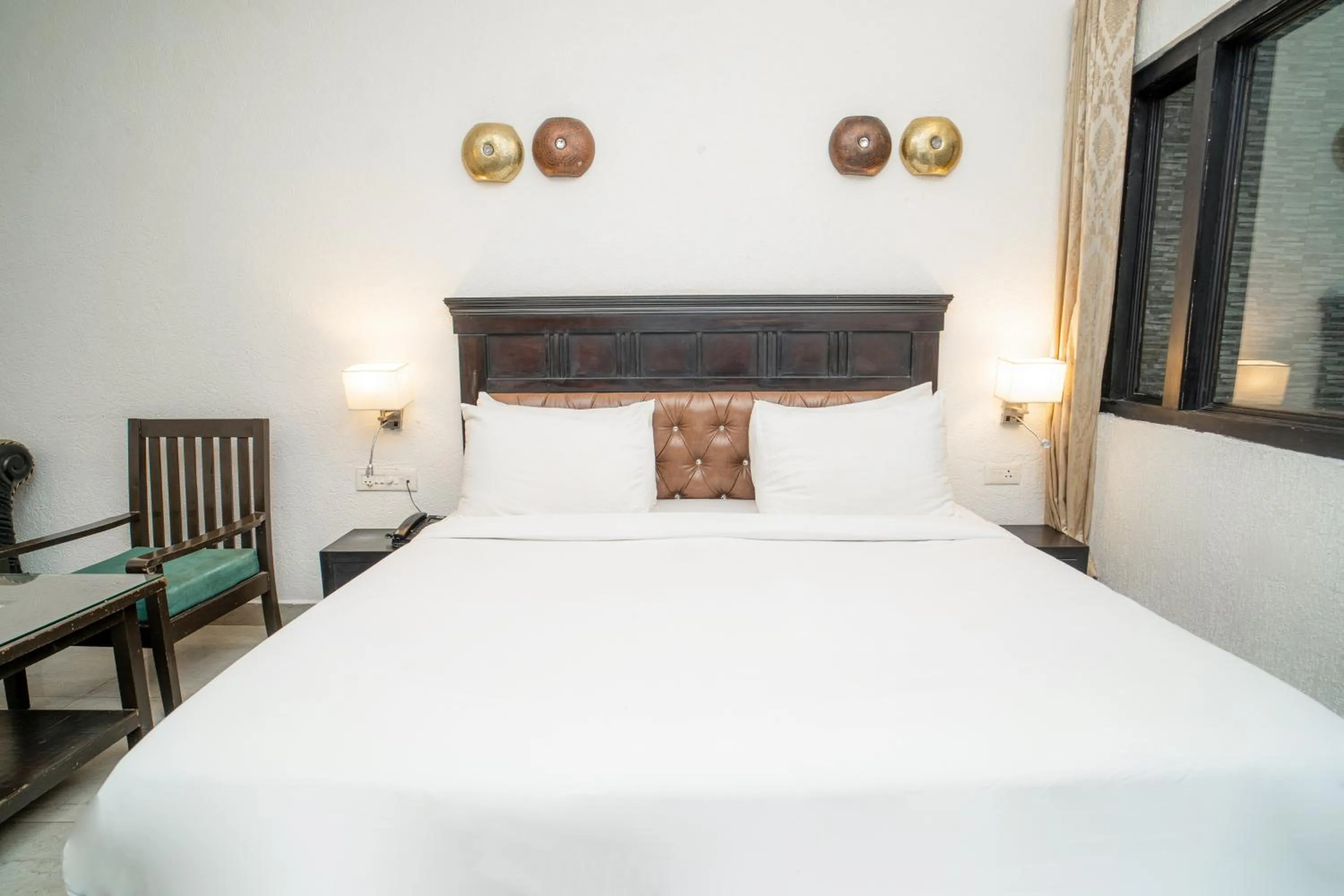 Bed in Hotel Ishan - A Ganges Riverside Retreat by Salvus