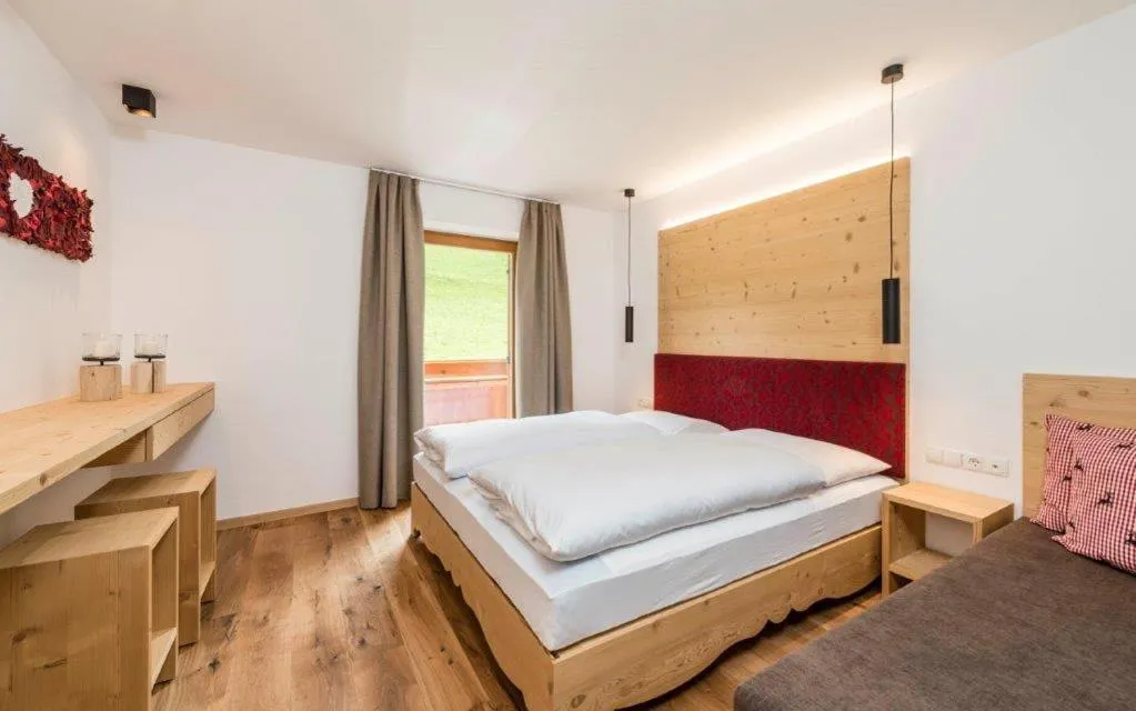 Photo of the whole room, Bed in Hotel Jaufentalerhof