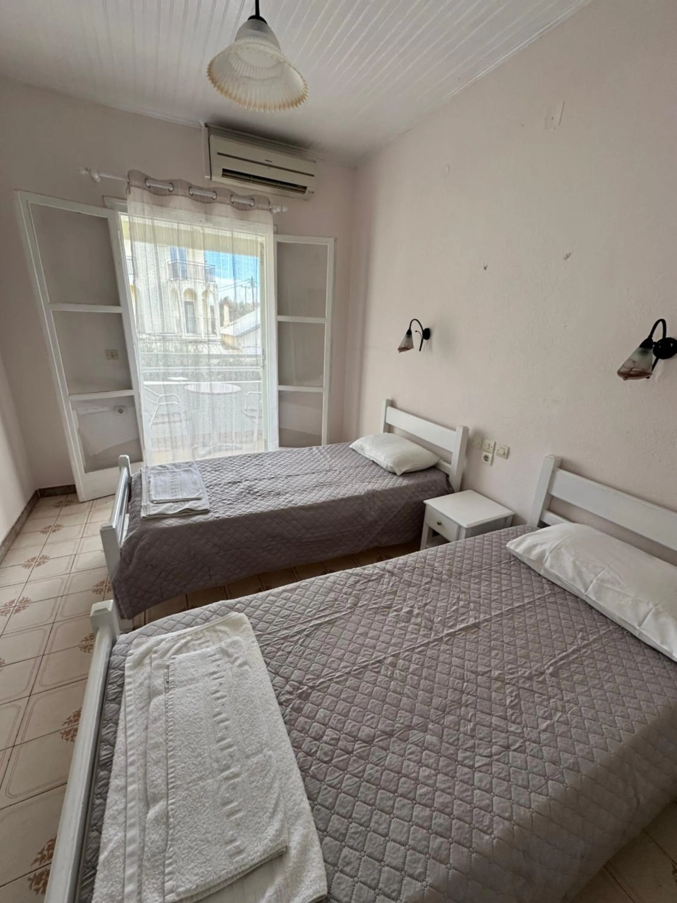 Bed in Alexandros Studios Apartments