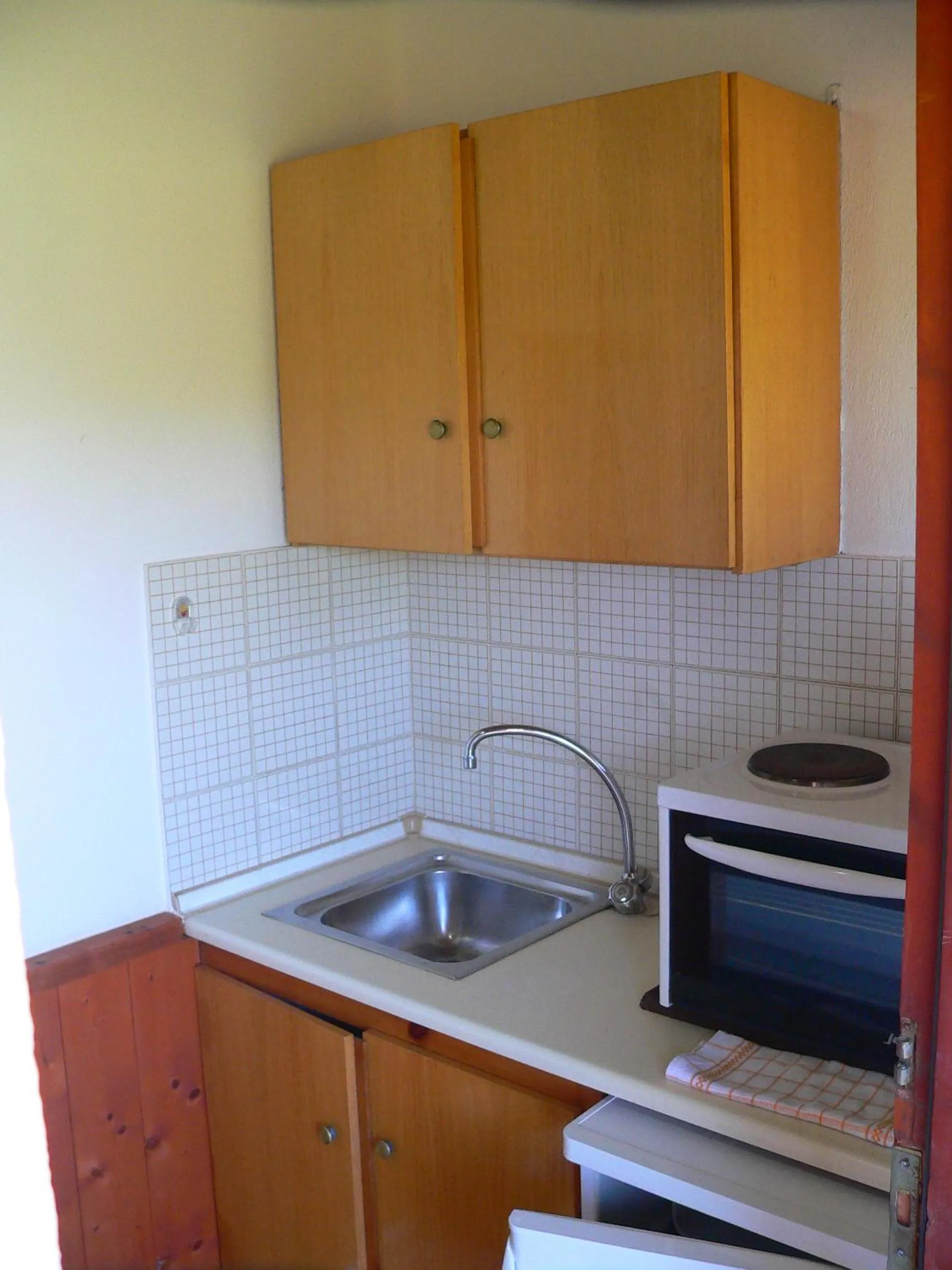 Kitchen or kitchenette in Alexandros Studios Apartments