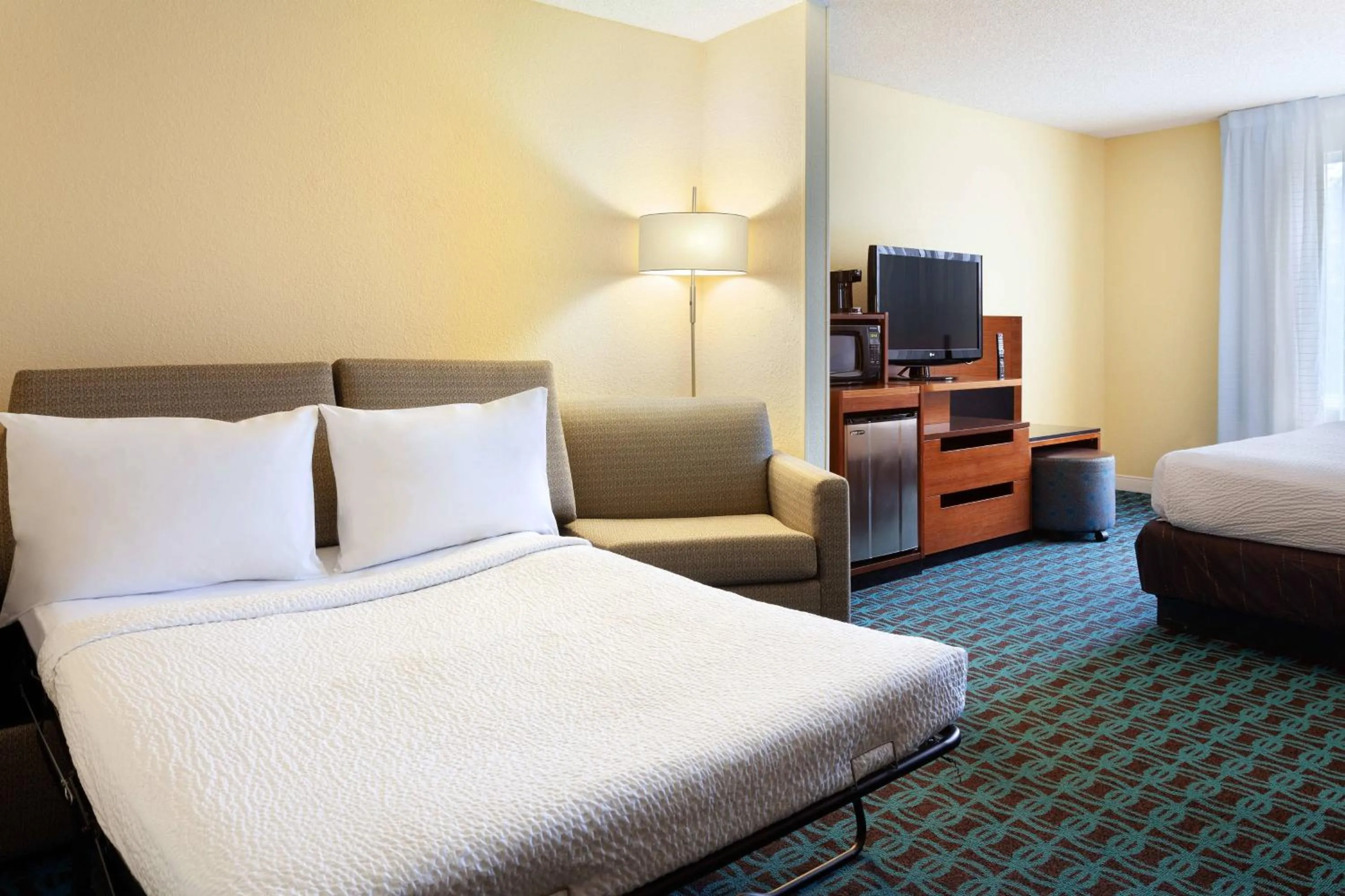 Photo of the whole room, Bed in Fairfield Inn & Suites by Marriott Orlando Lake Buena Vista in the Marriott Village