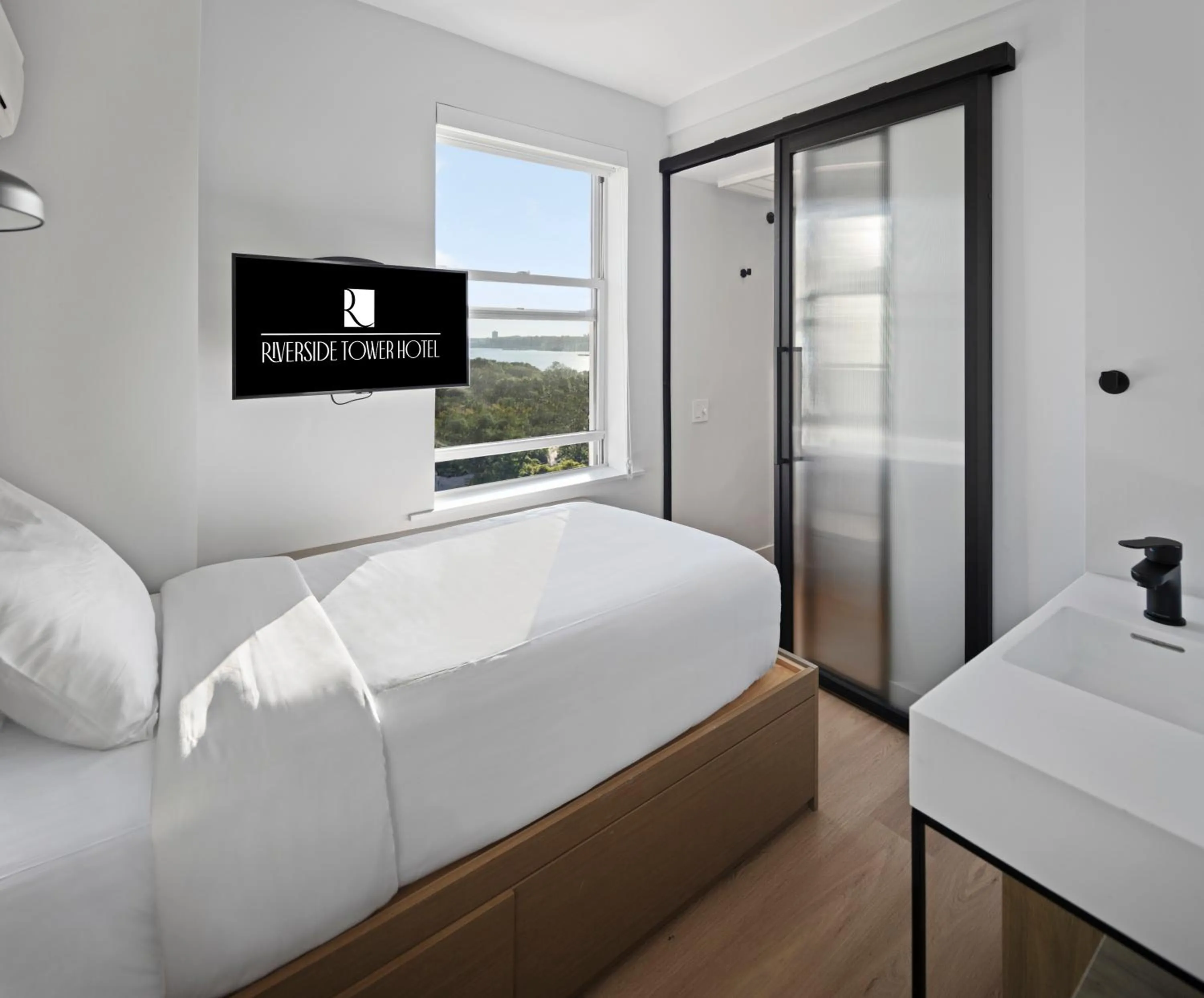 Bed in Riverside Tower Hotel