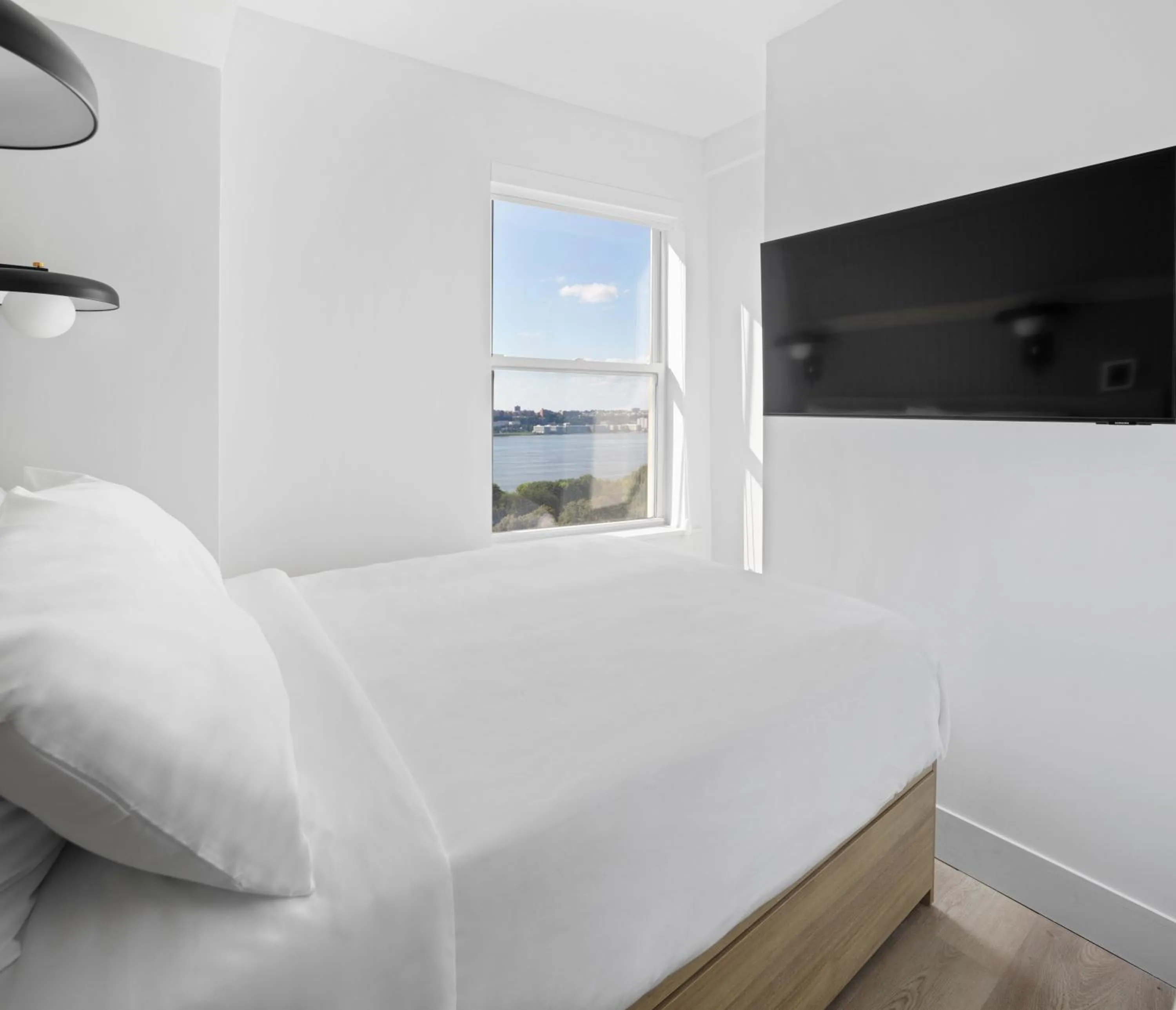 Bed in Riverside Tower Hotel