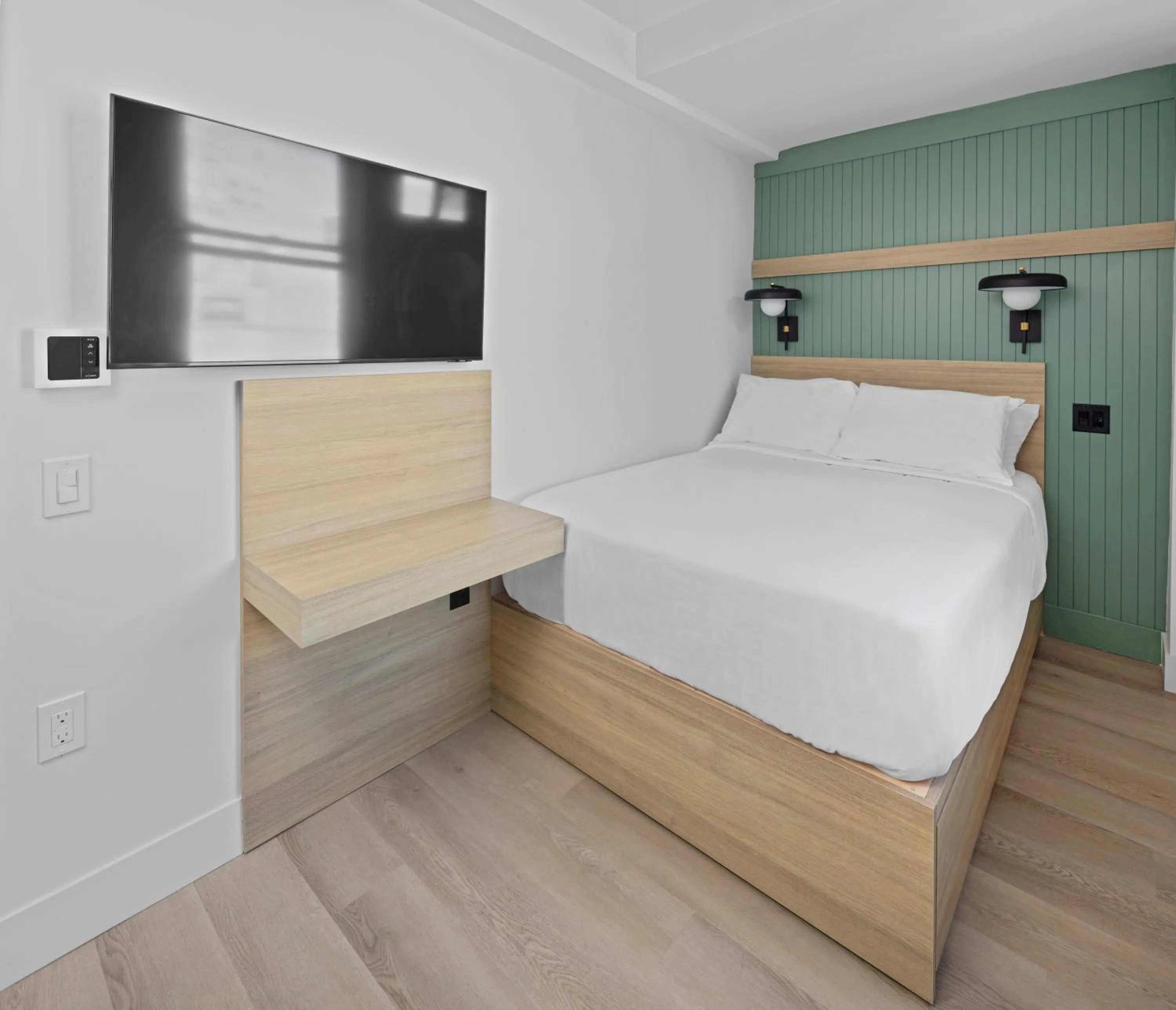 Bed in Riverside Tower Hotel