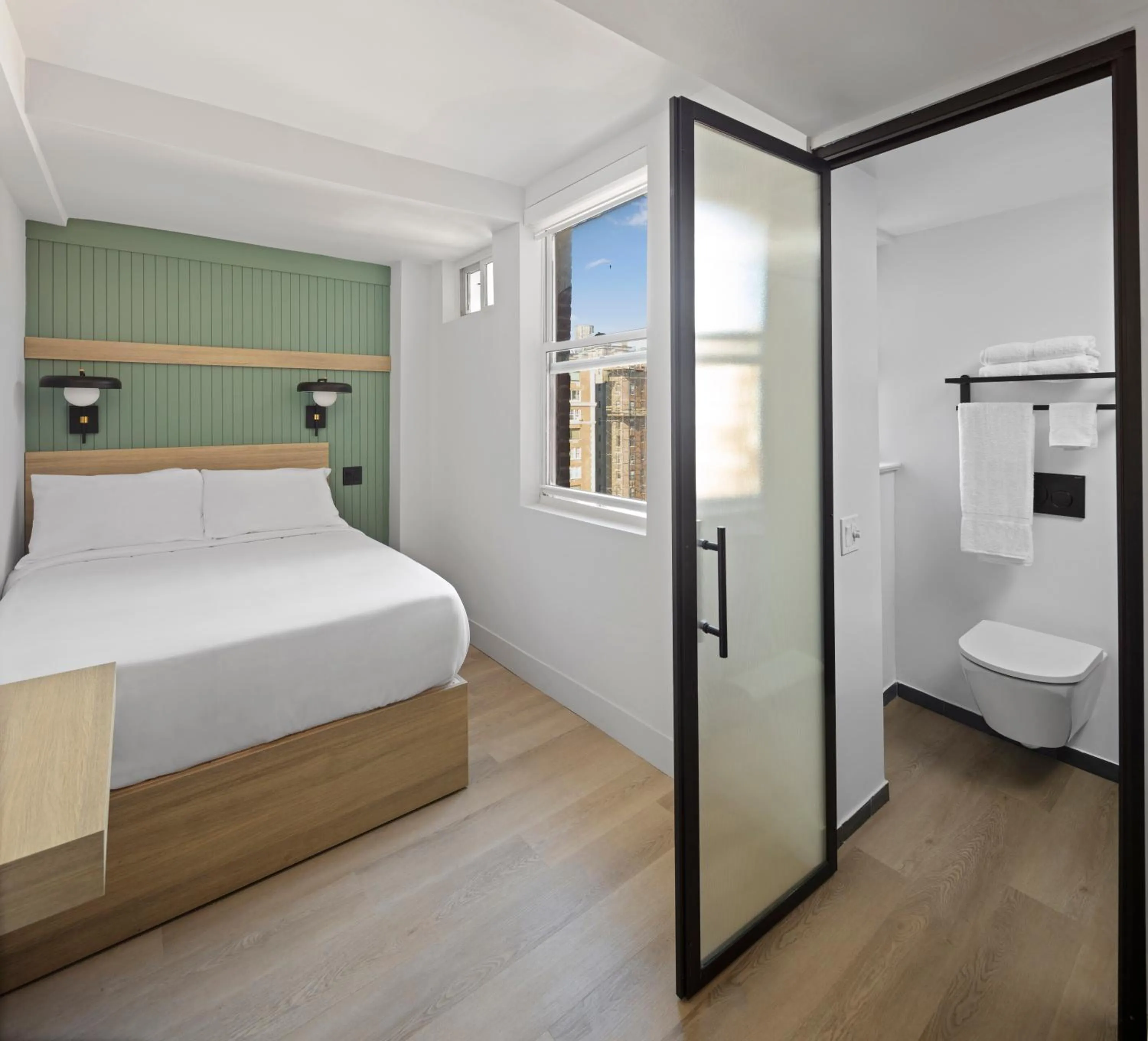 Bed in Riverside Tower Hotel