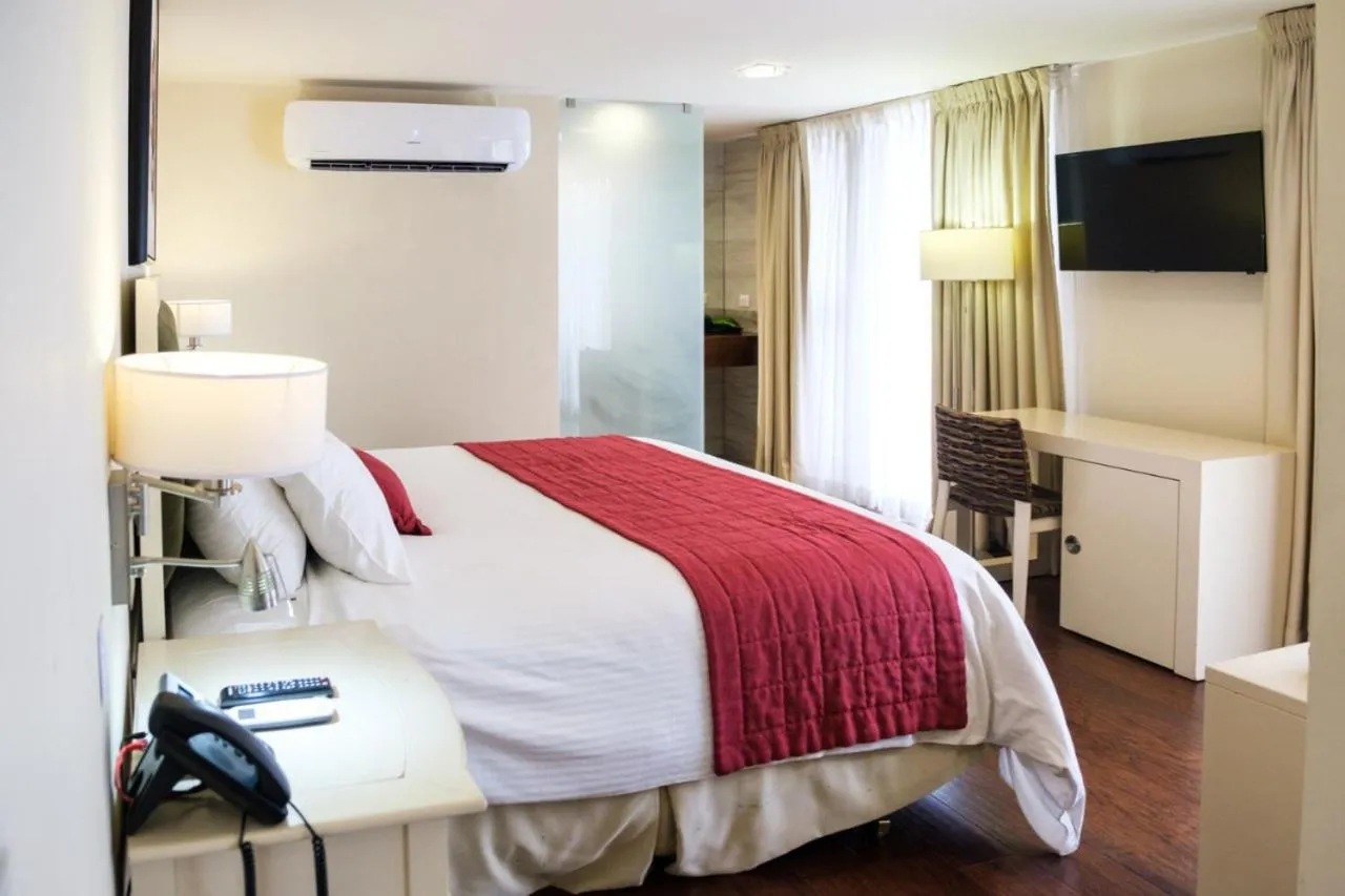 Communal lounge/ TV room, Bed in Isabella Boutique Hotel