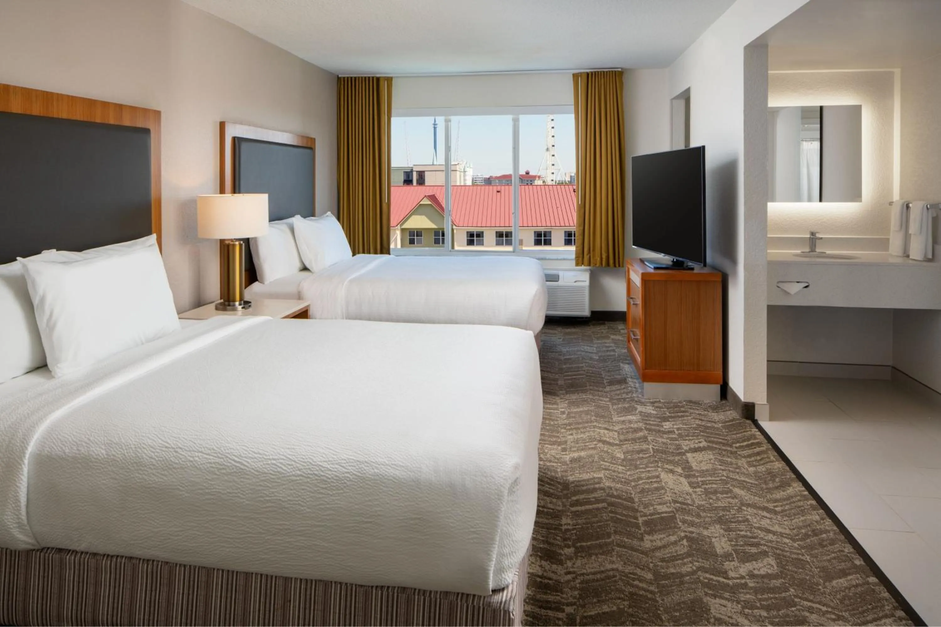 Photo of the whole room, Bed in SpringHill Suites by Marriott Orlando Convention Center