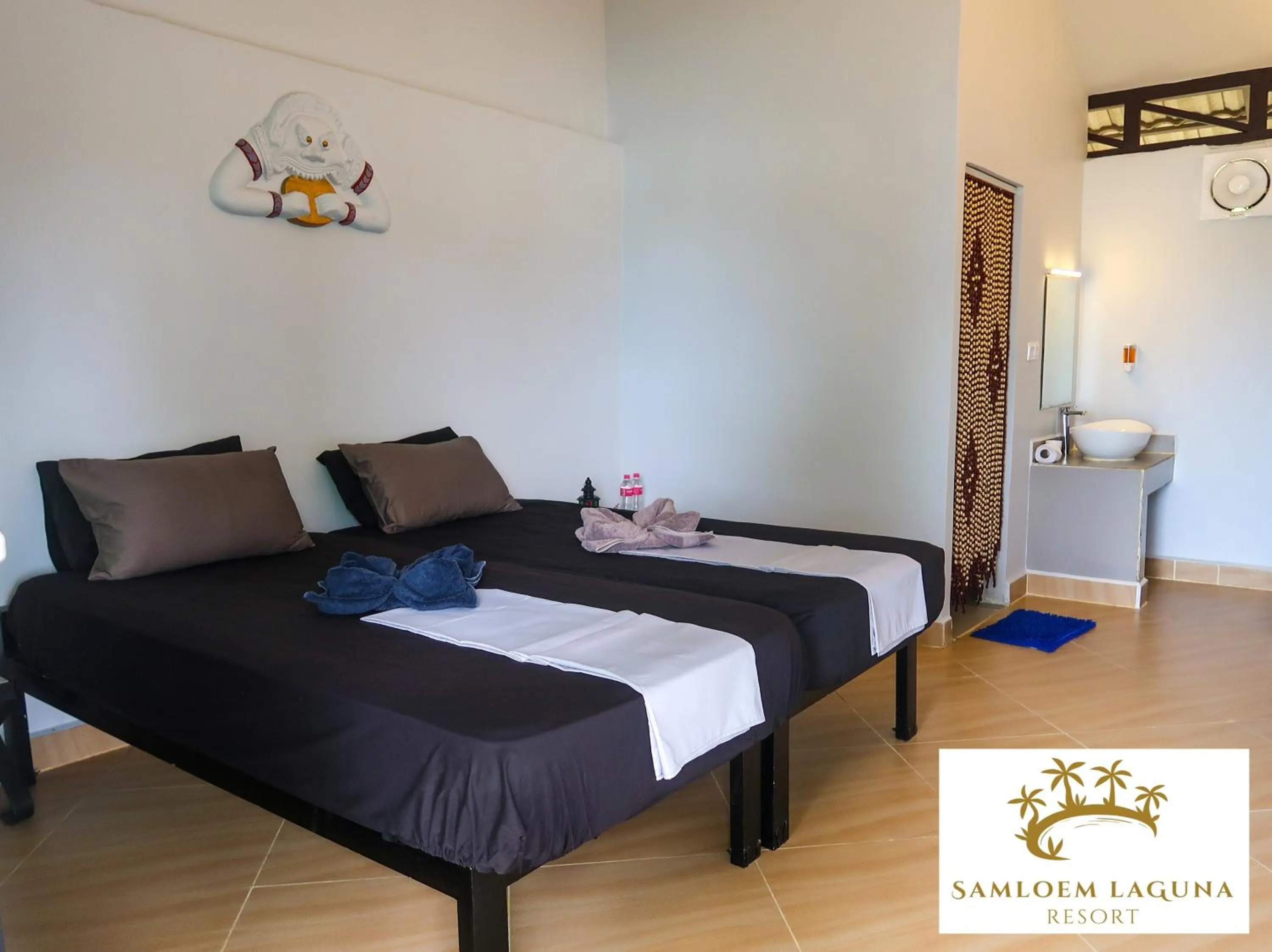 Bed in Samloem Laguna Resort