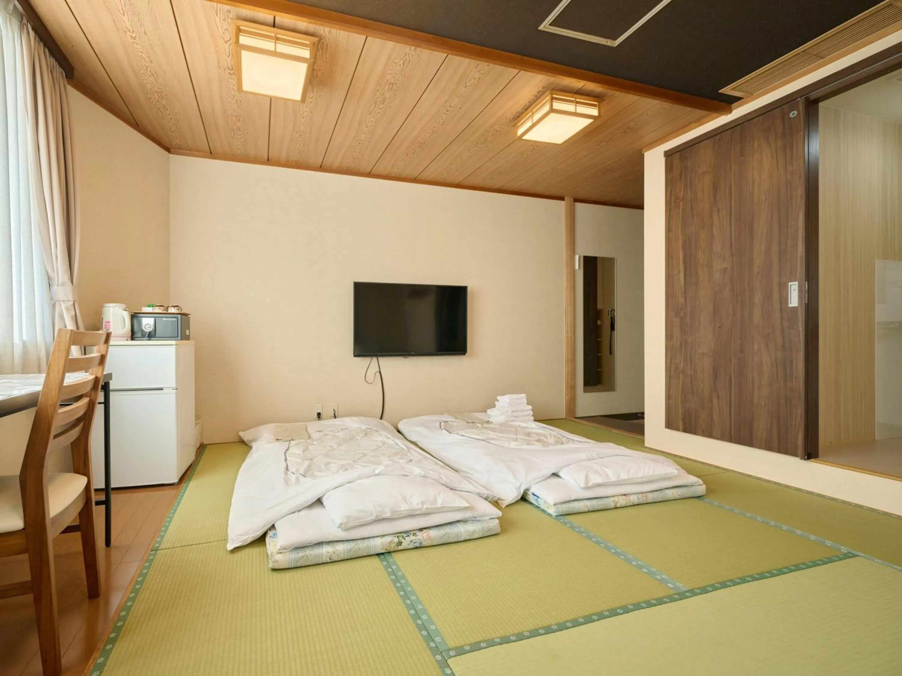 Photo of the whole room, Bed in Okasan Hotel