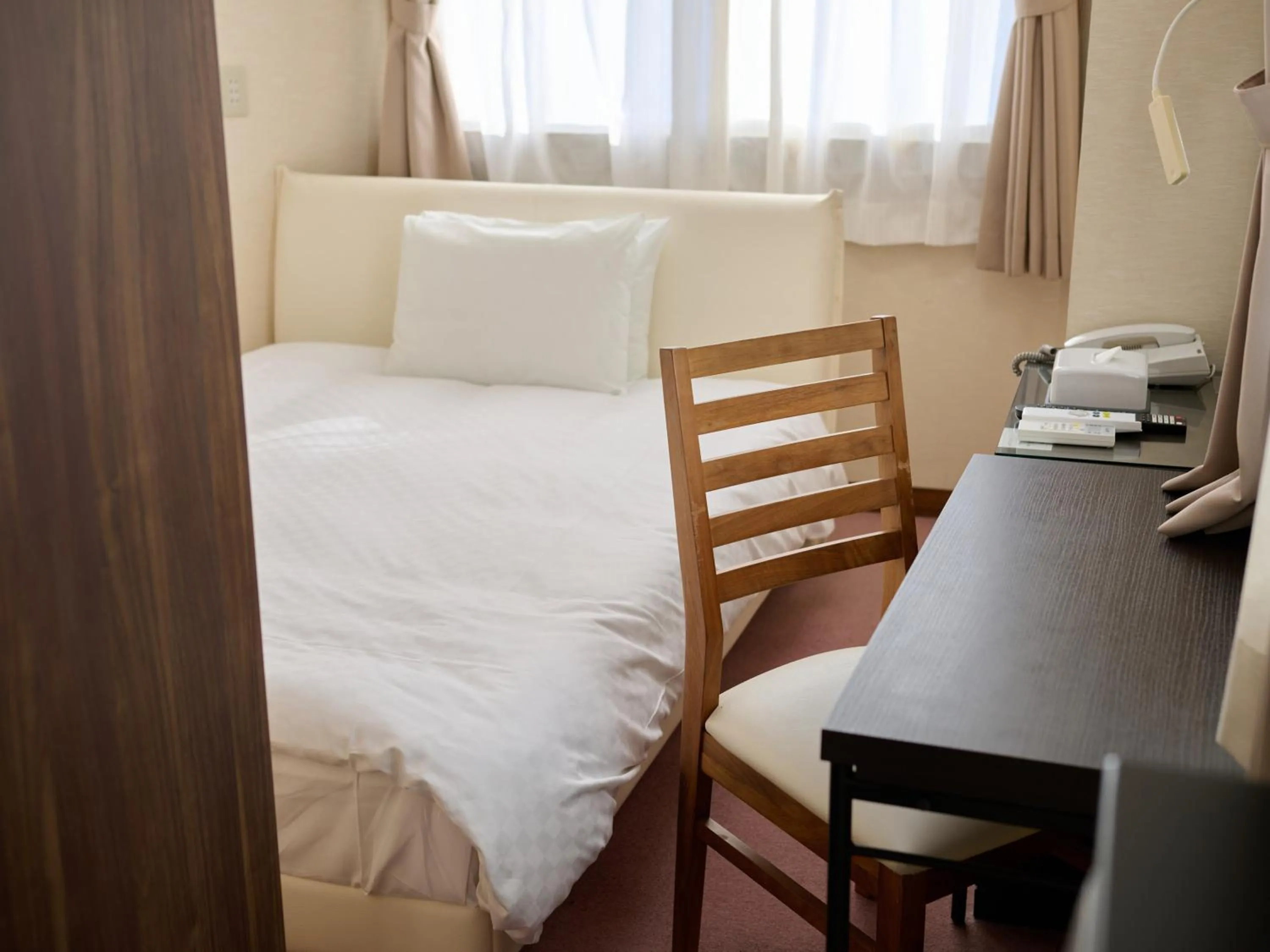 Photo of the whole room, Bed in Okasan Hotel