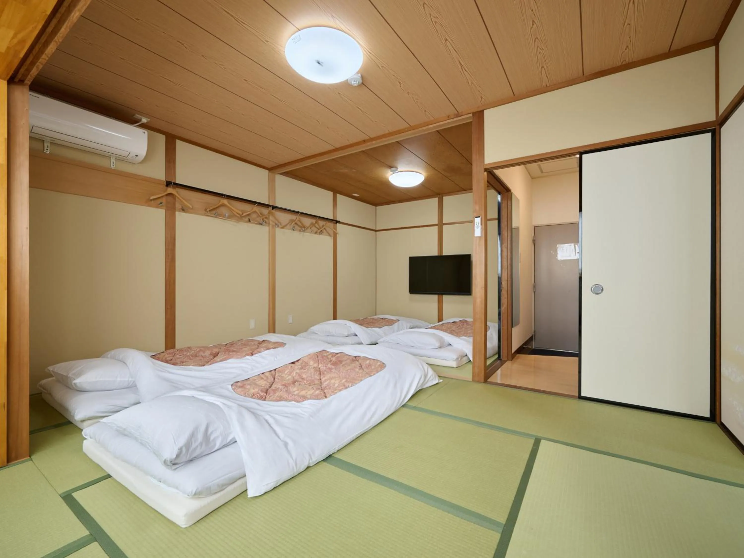 Photo of the whole room, Bed in Okasan Hotel