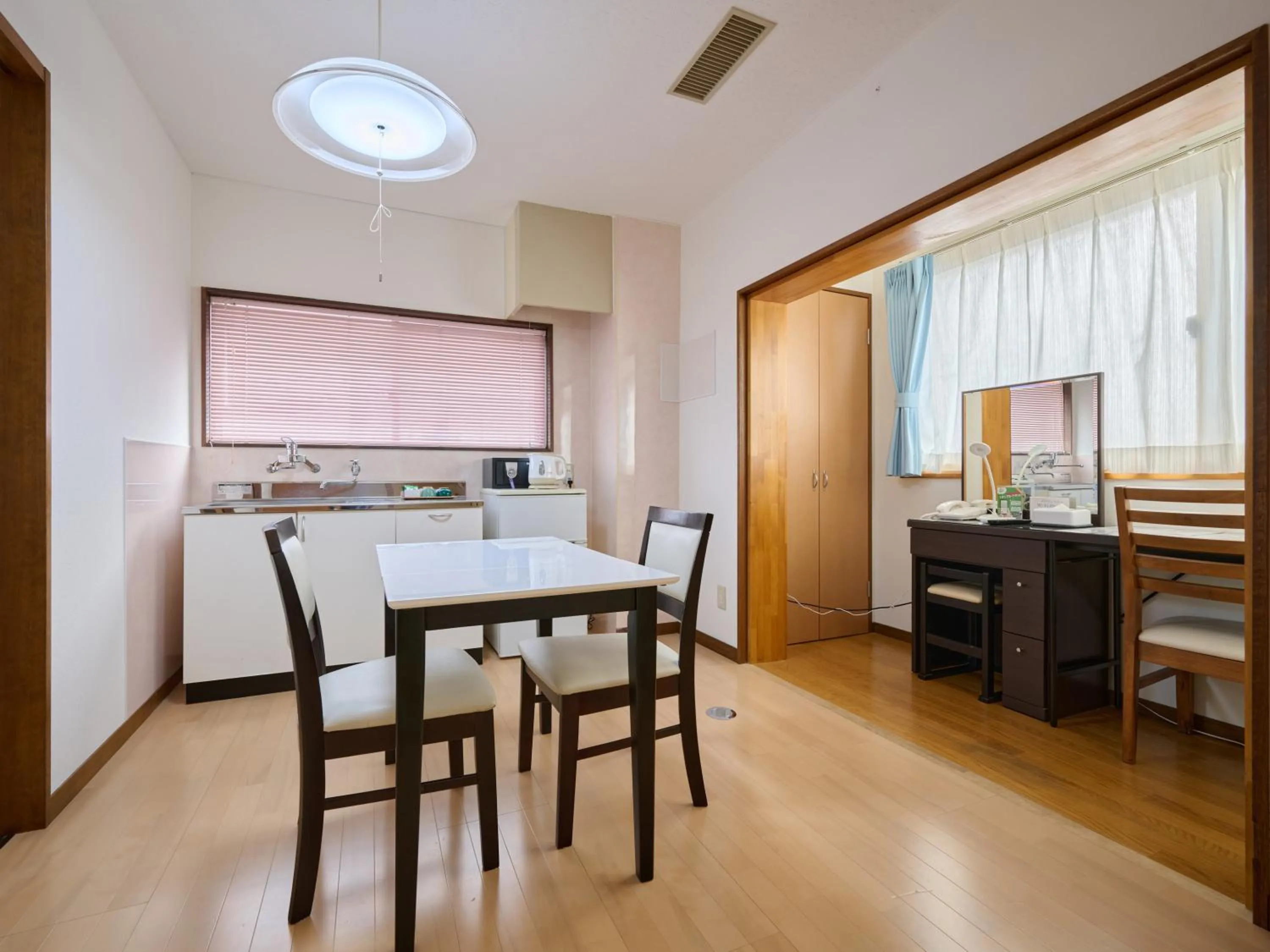Kitchen or kitchenette in Okasan Hotel