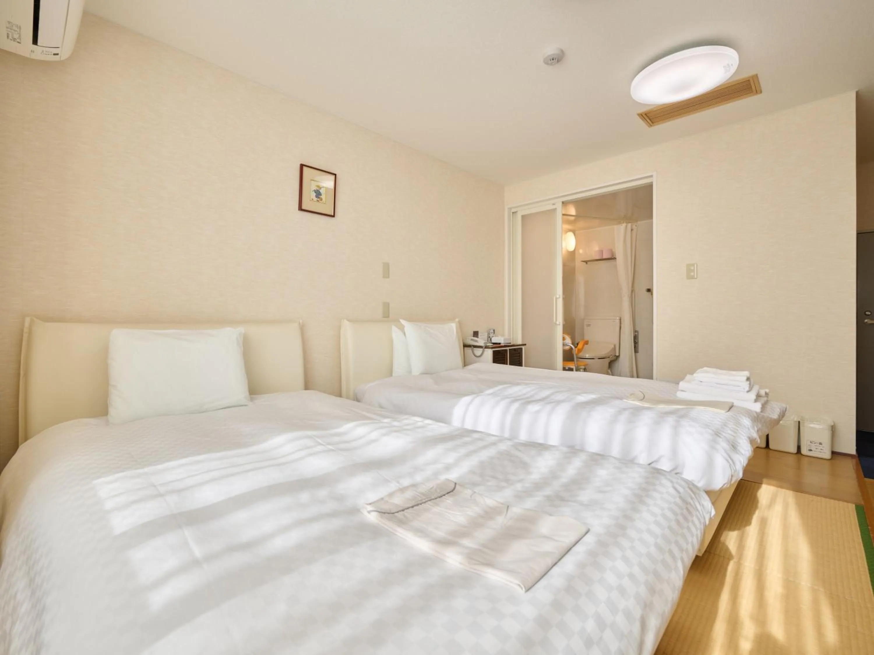 Photo of the whole room, Bed in Okasan Hotel