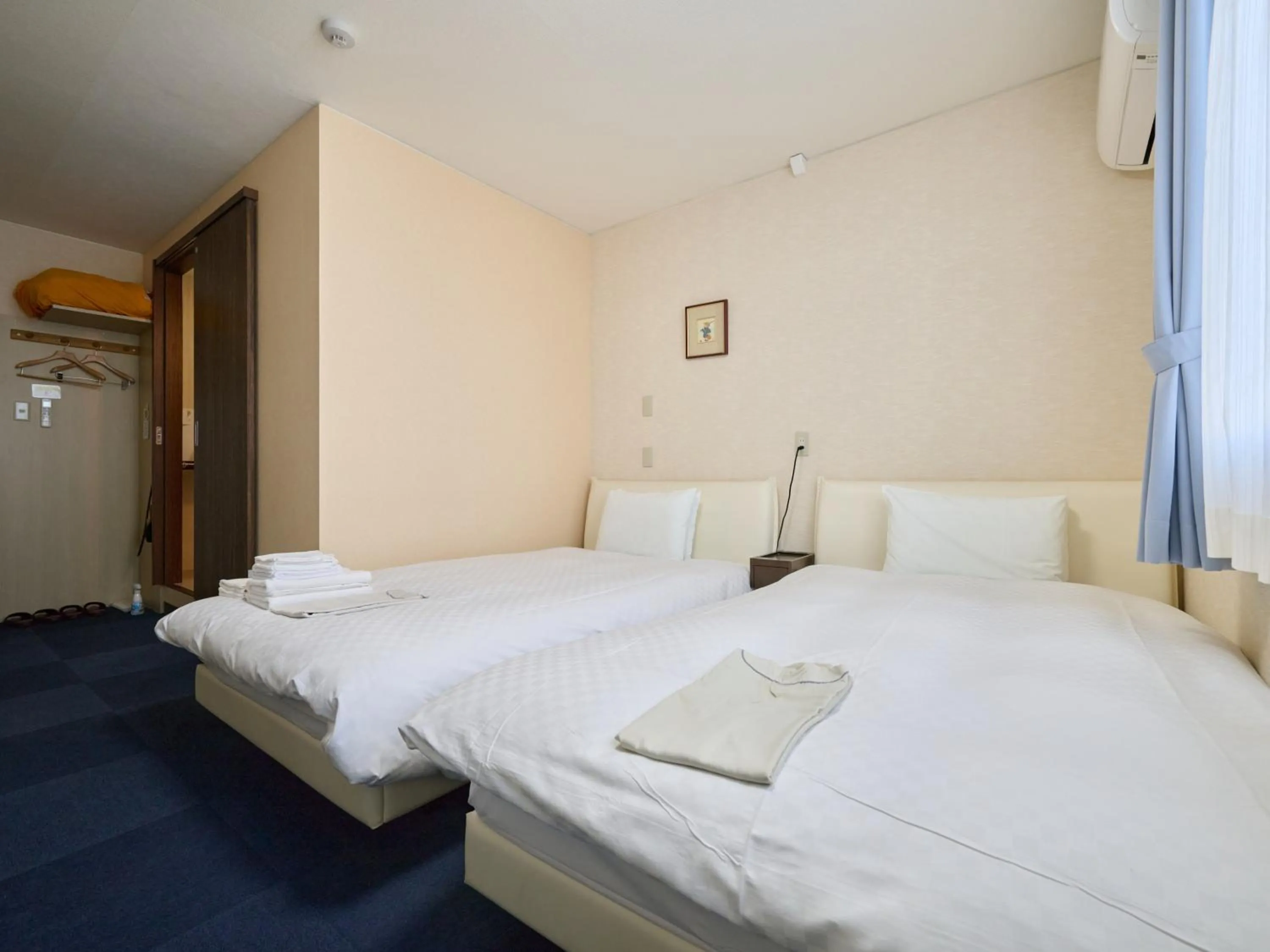 Photo of the whole room, Bed in Okasan Hotel