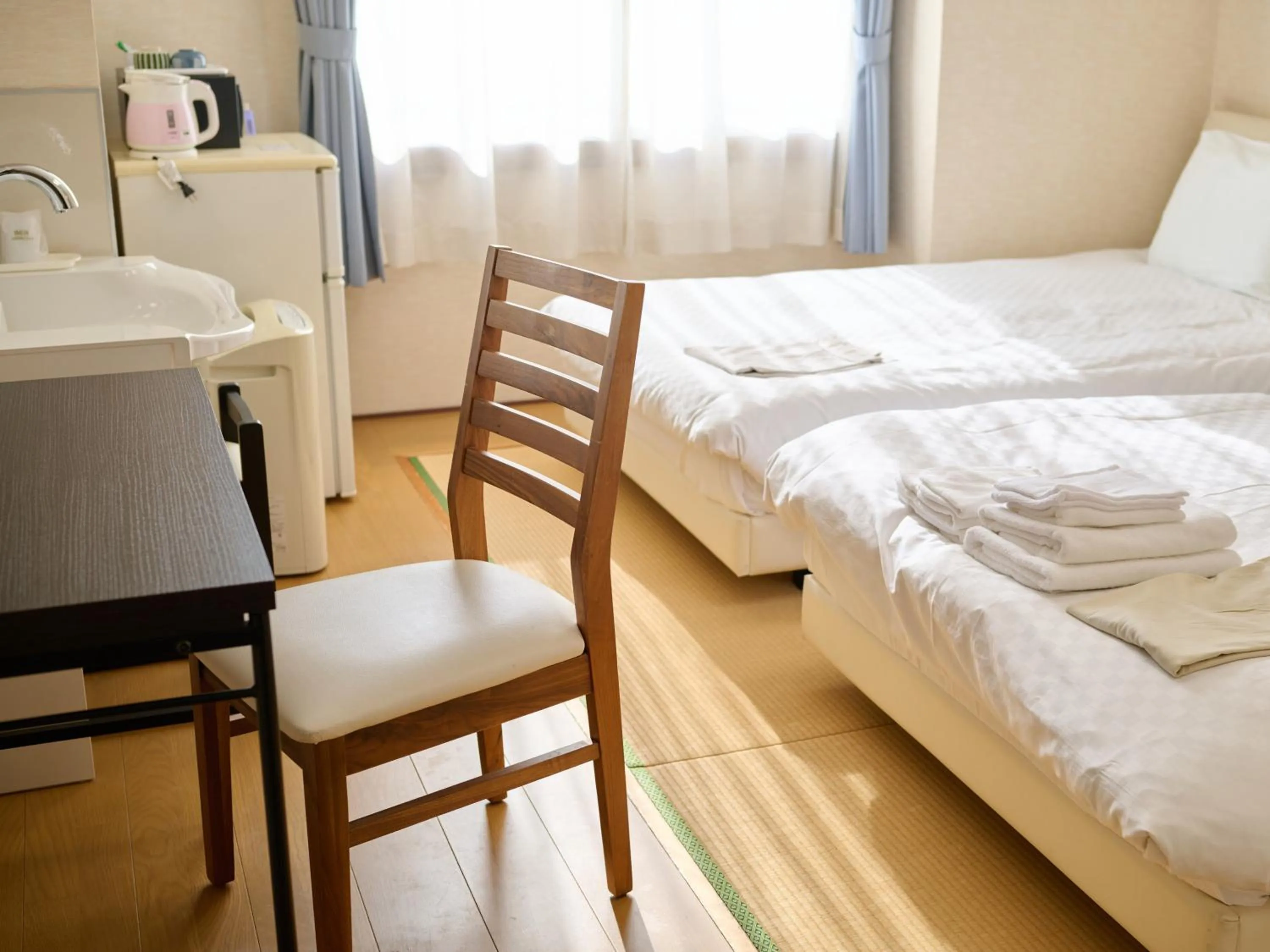 Photo of the whole room, Bed in Okasan Hotel