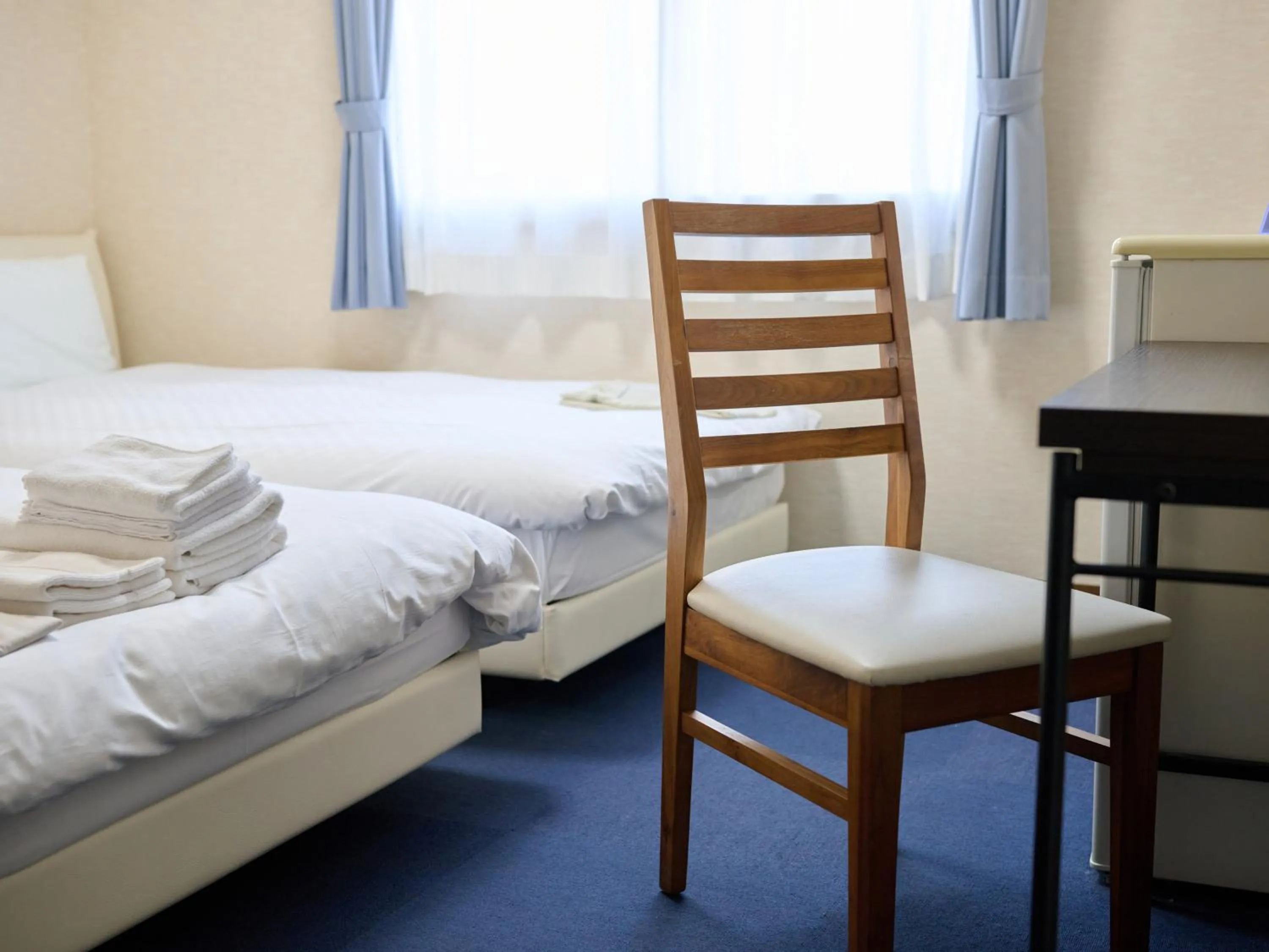Photo of the whole room, Bed in Okasan Hotel