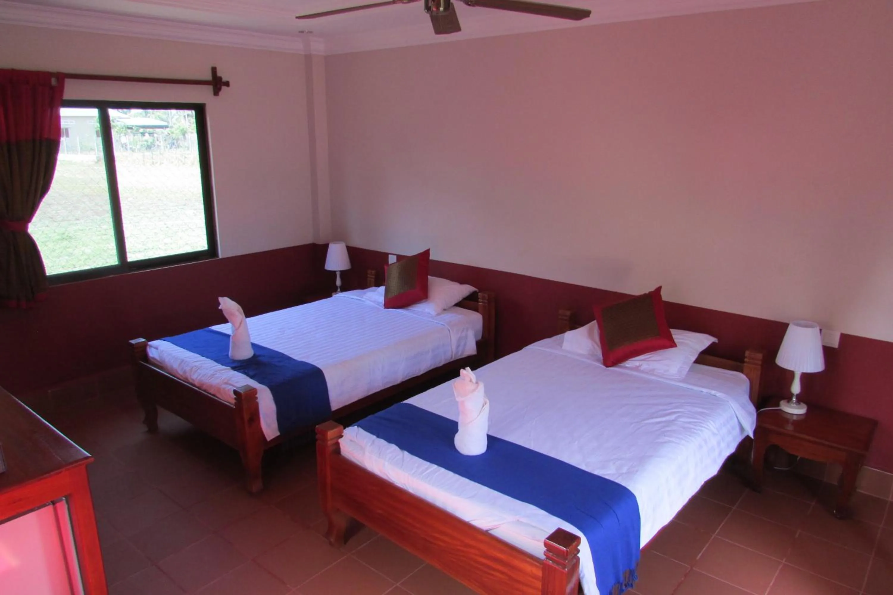Photo of the whole room, Bed in Phoumrumduol Bungalow