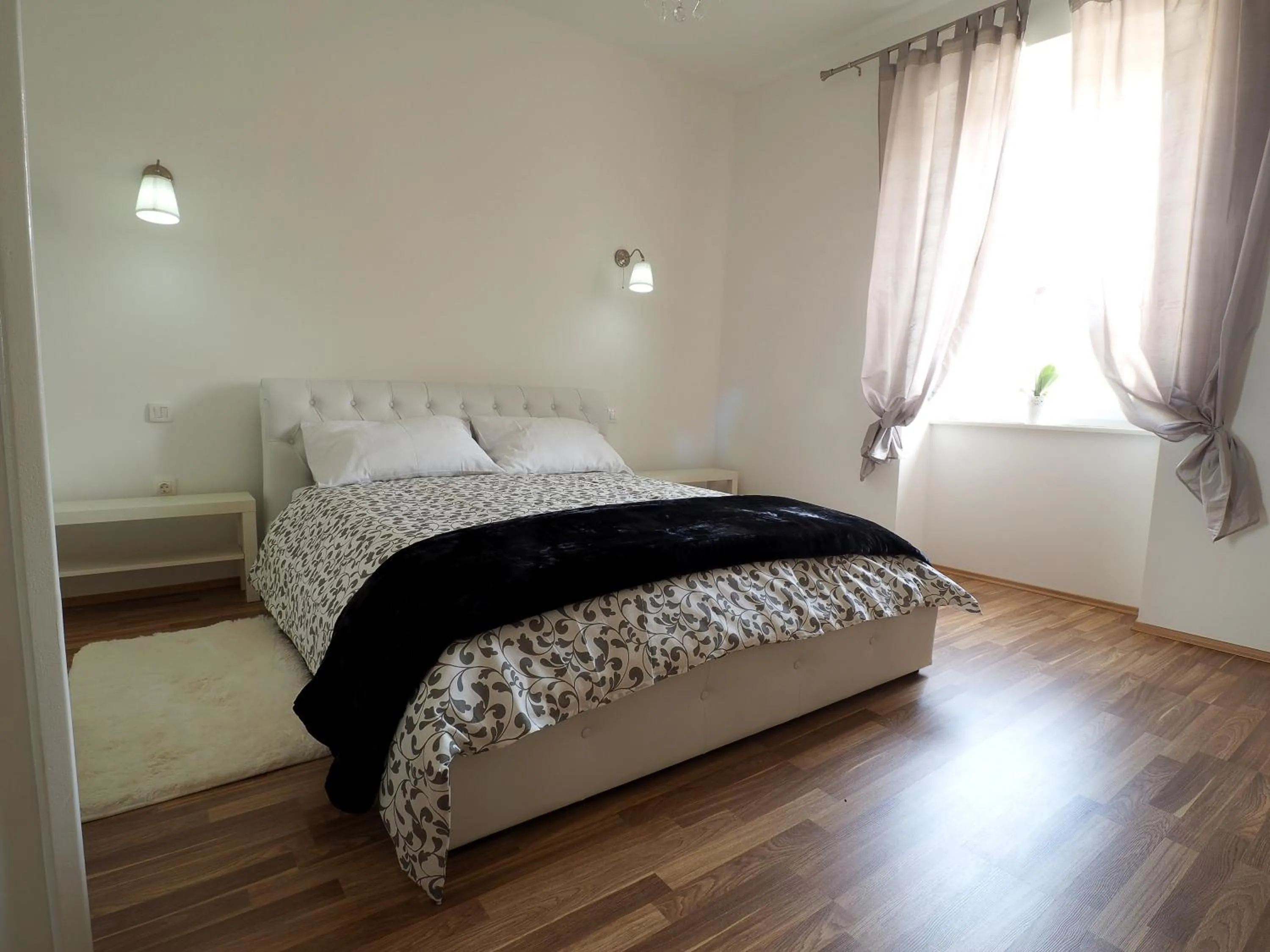 Bed in Captain Emo City Apartments