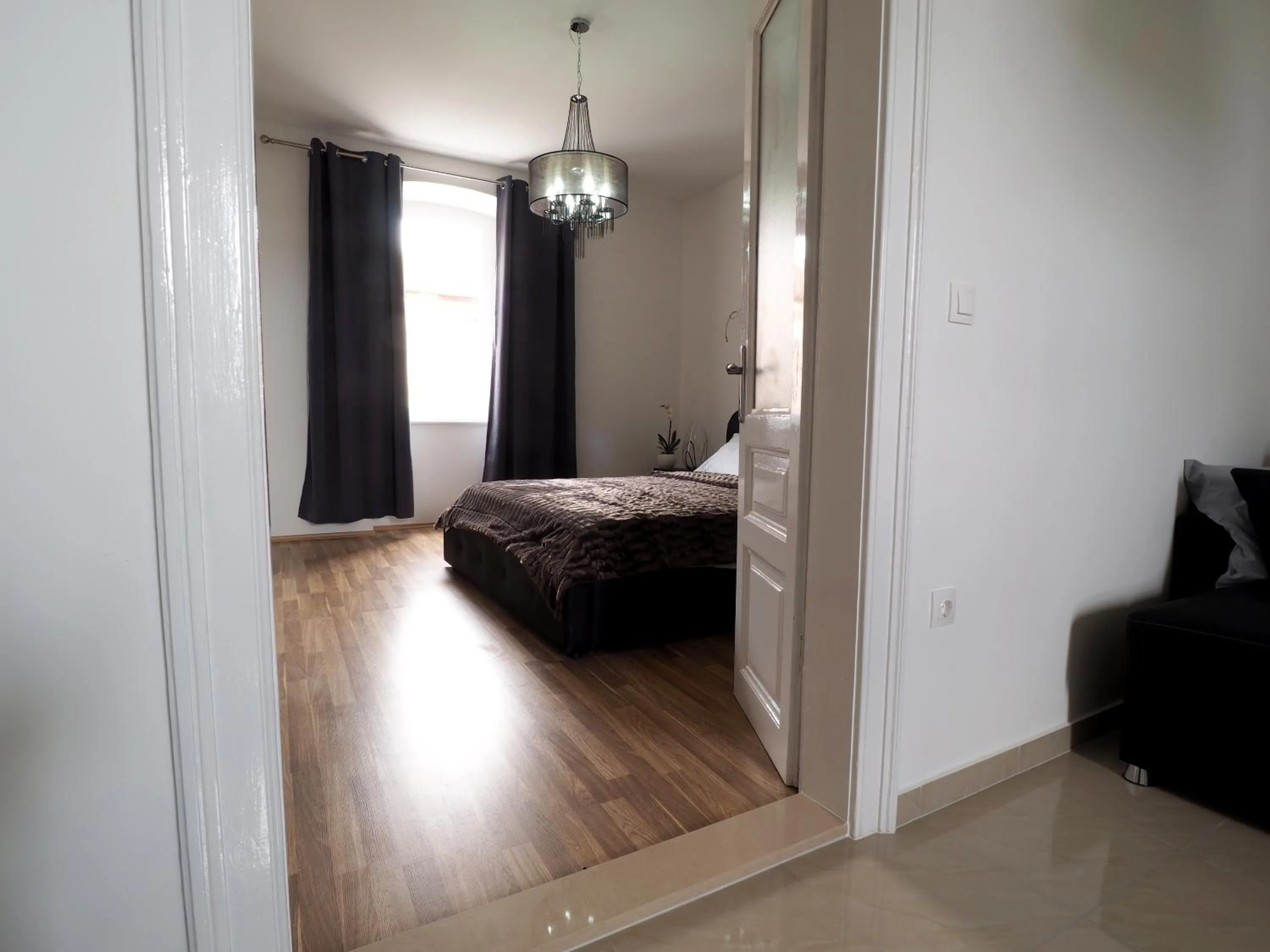 Photo of the whole room, Bed in Captain Emo City Apartments