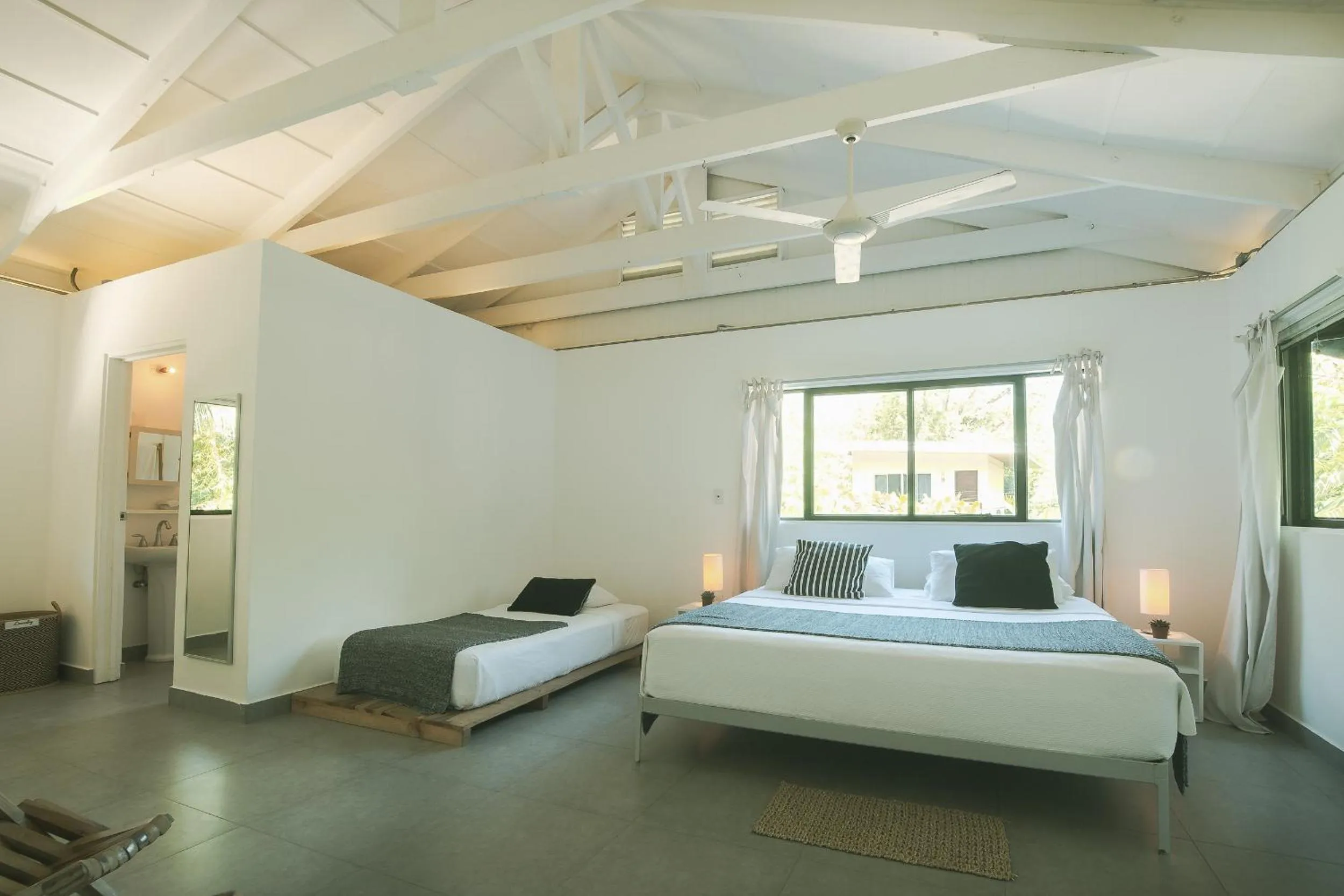 Photo of the whole room, Bed in La Negra Surf Hotel